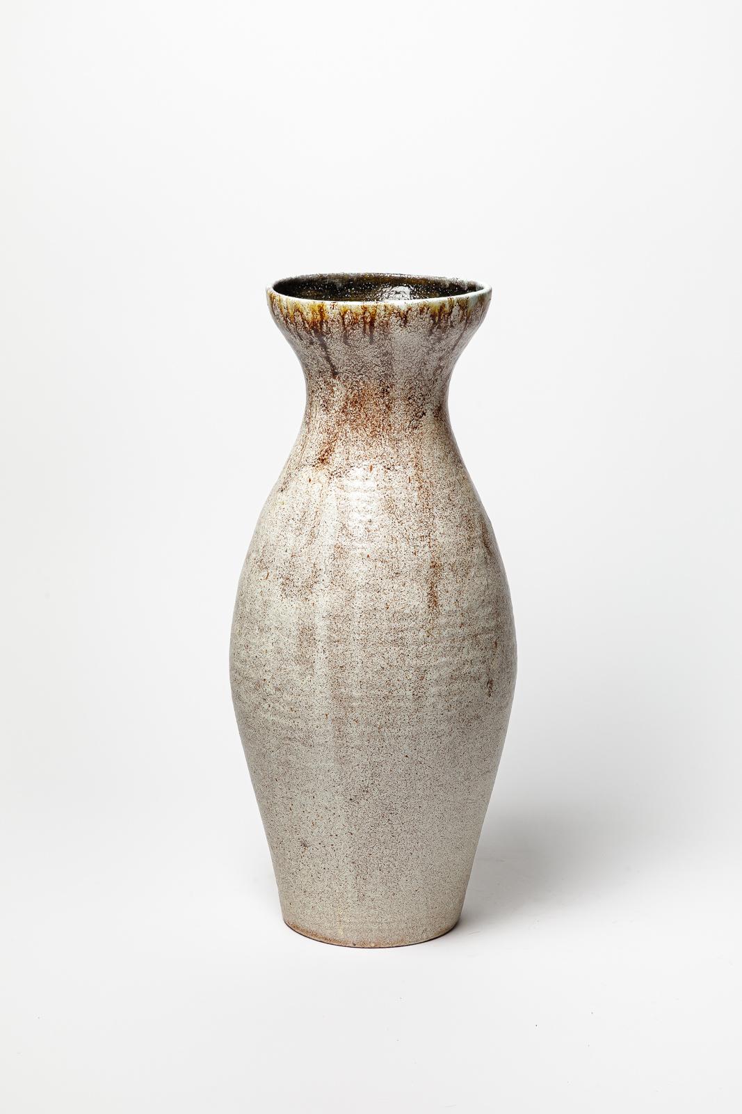White glazed stoneware vase by Accolay.
Artist signature under the base. Circa 1960-1970. 
H : 18.9’ x 7.1’ inches.