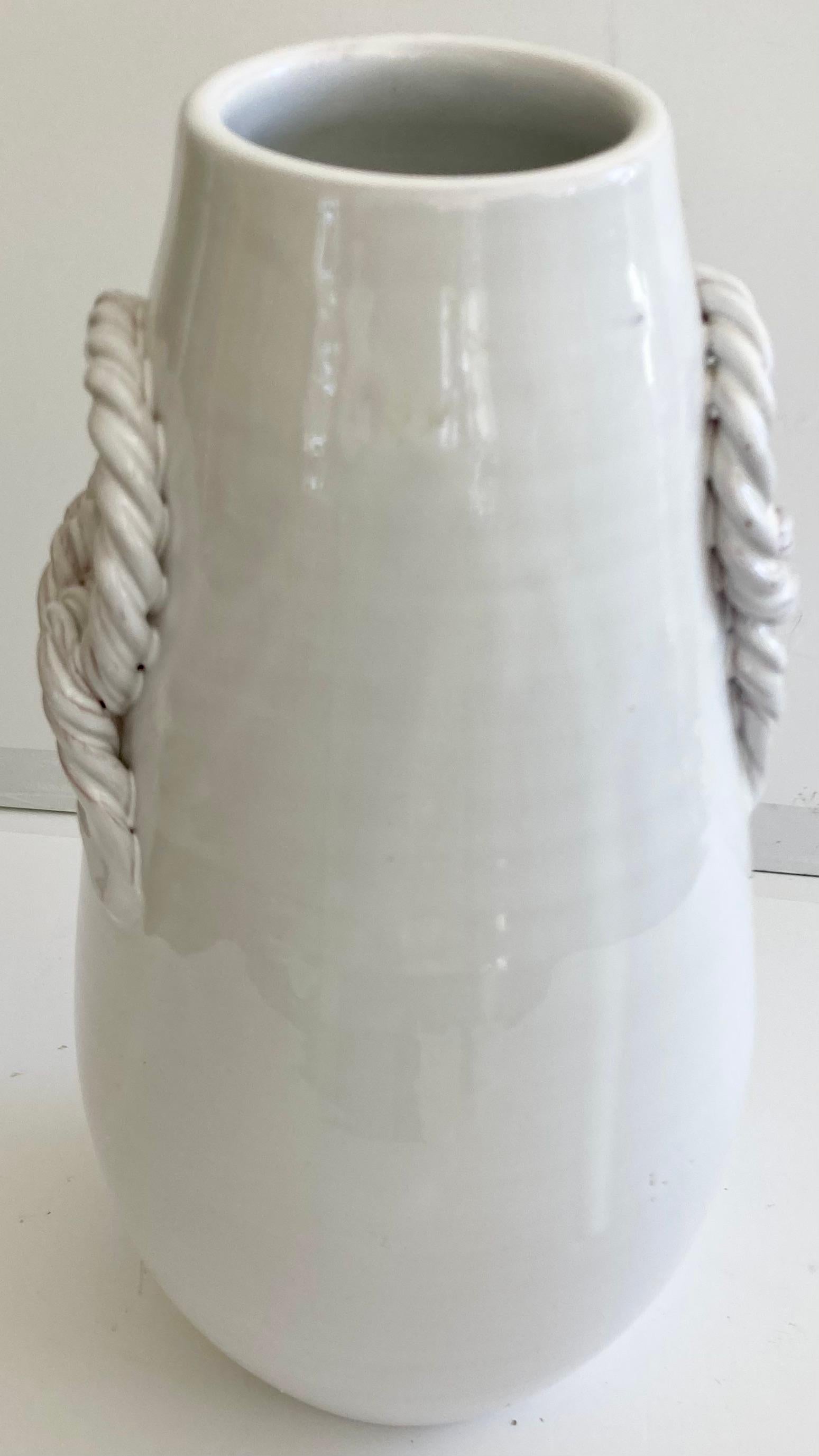 Beautiful modern white glazed ceramic vase with beaded handles. Add some artistic style to your design project. Handmade in Italy with persona, craftsmanship, and details.