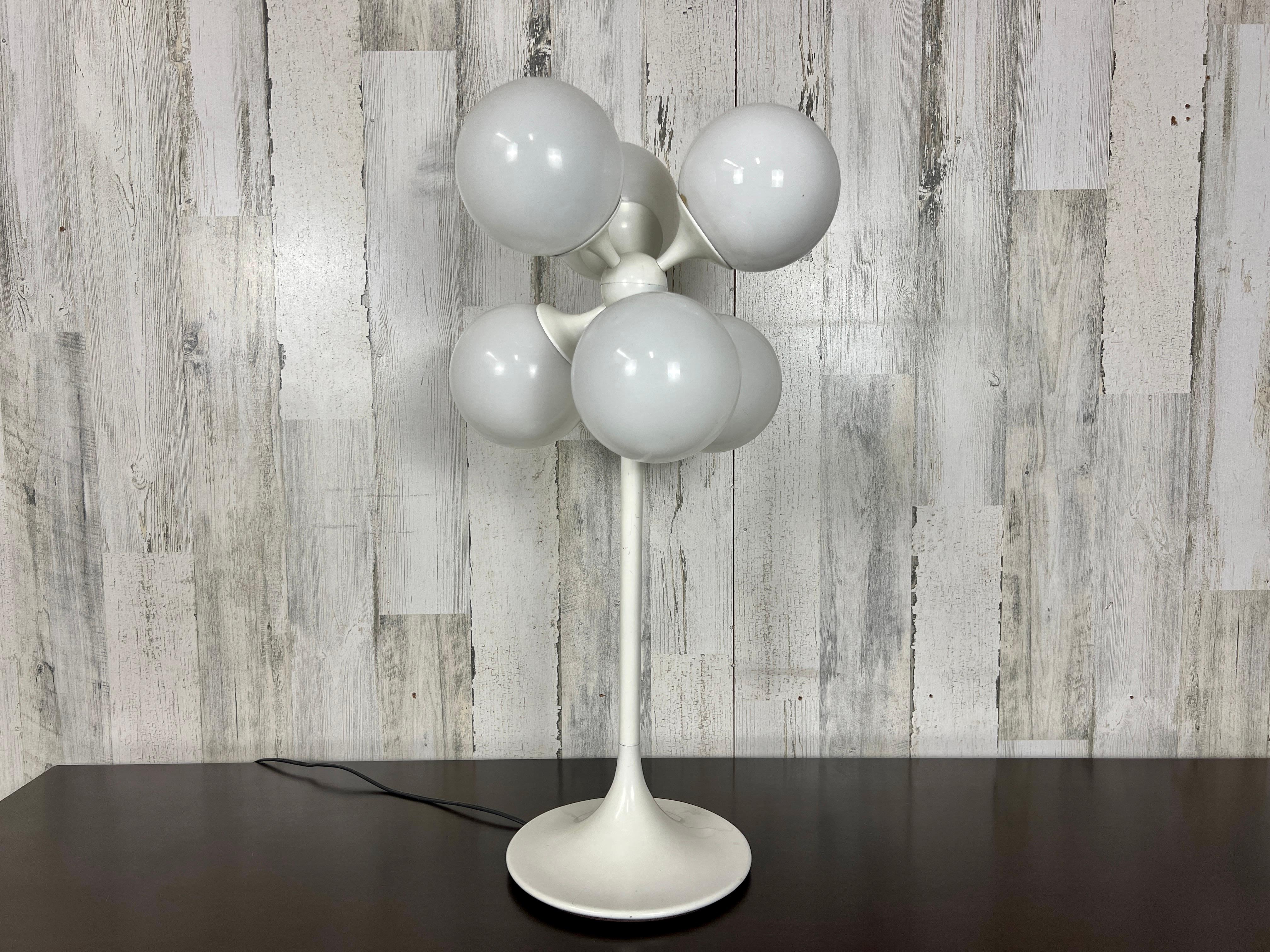 White globe table lamp with a 