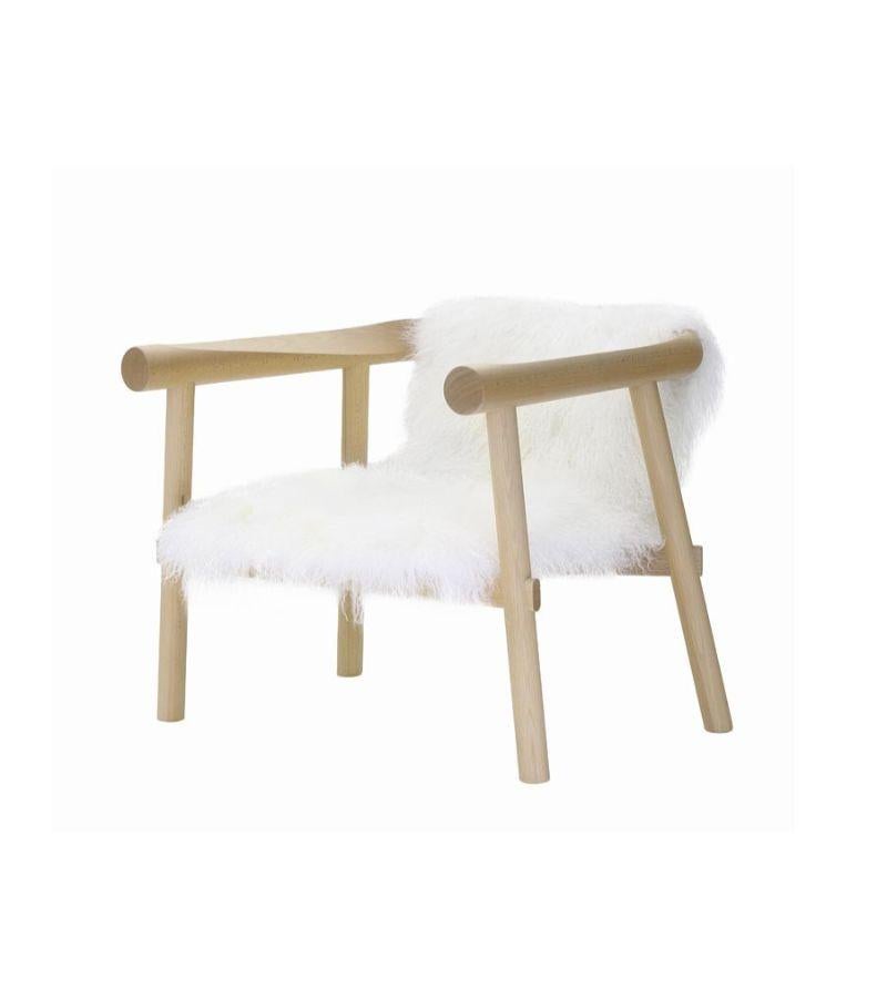 White Goatskin Altay armchair by Patricia Urquiola
Materials: Structure in varnished natural solid beech. Seat covered with white Mongolian goatskin
Technique: Varnished wood. Upholstered in natural skin. 
Dimensions: D 73 x W 73 x H 63