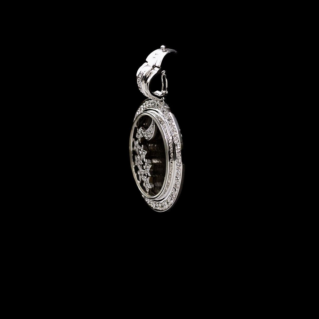 A stunning & fun diamond pendant, this piece is inspired by Chopard's Happy Diamonds Collection. It features scintillating round brilliant cut diamonds that are set into white gold moon & star shapes that are freely floating inside the pendant. The