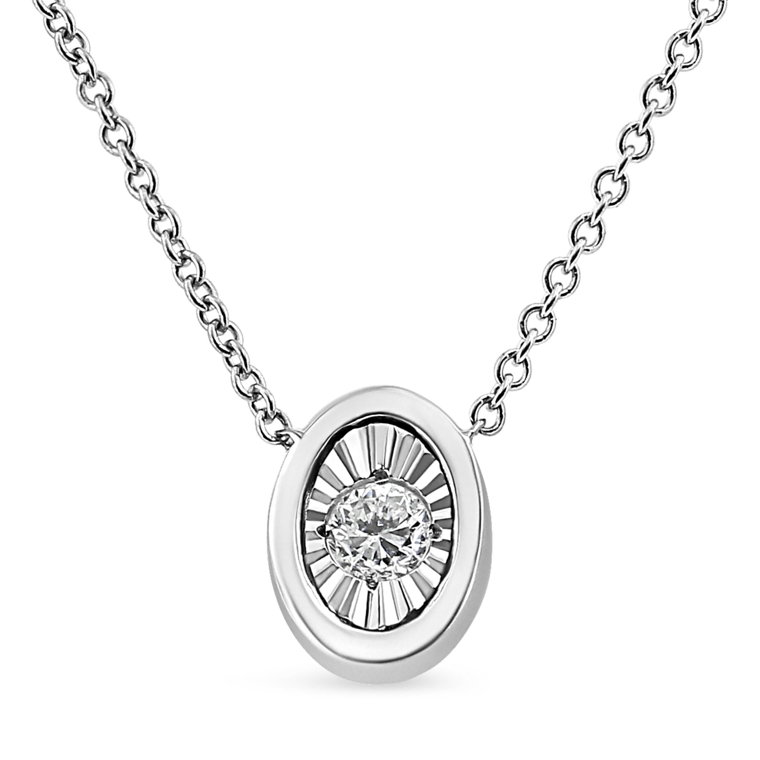 Haven’t we all had the dream of getting ready like a queen for that special day. This oval shaped diamond pendant necklace is designed for that queen in you. This 10k white gold pendant is studded with a single 1/10 carat round-cut diamond and is a