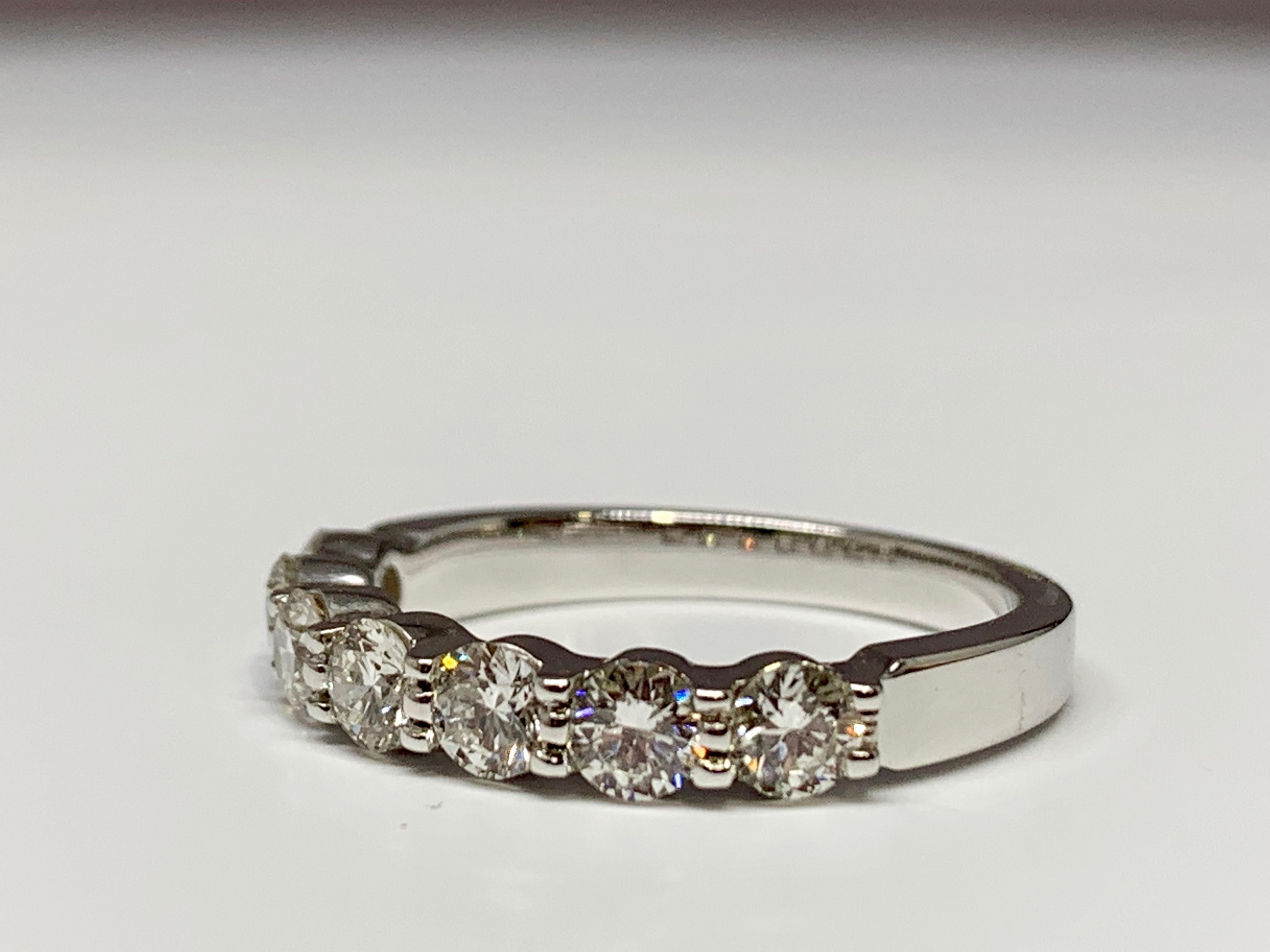 This classic shared-prong wedding band features 7 diamonds that total 1 carat in weight. This diamonds have a clarity grade between VS2-SI1 and a color grade of H. This wedding band is currently a size 6.5 but can be resized upon request! 