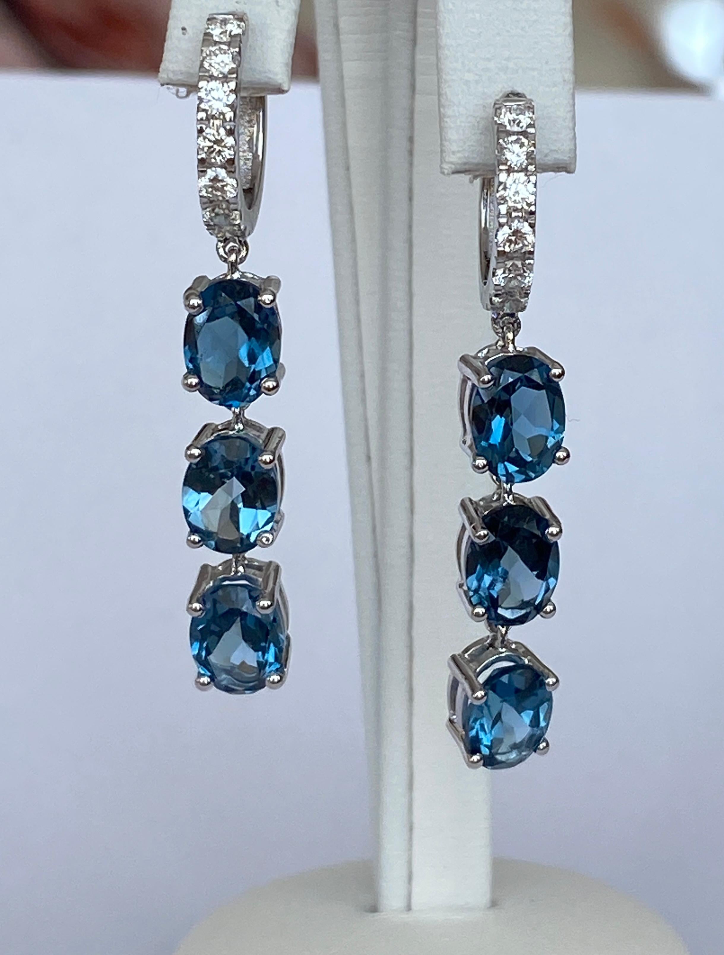Offered are exceptionally beautiful earrings in 18 kt white gold with 6 stones  oval shape London Blue Topaz  approx. 10.00 ct and decorated with 14 stones brilliant cut diamonds of approx. 0.65 ct F/G/VS. Own certificate for the diamonds.
Gold