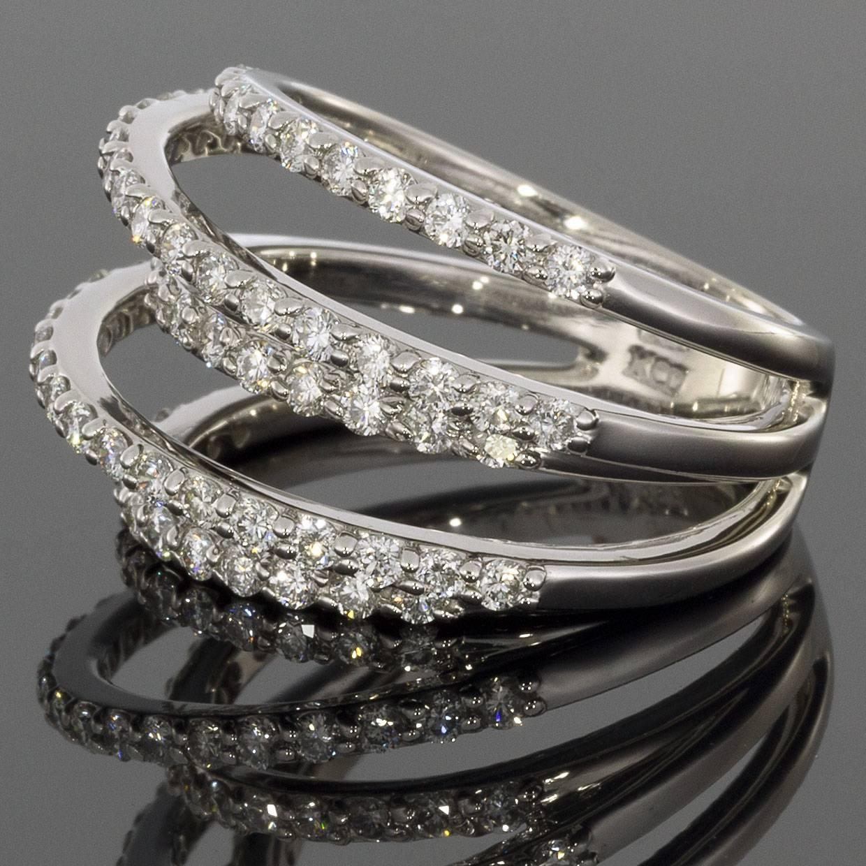 This unique ring would make a wonderful statement or even anniversary ring. The wrap-style ring is comprised of 14 karat white gold & features five rows of round brilliant cut diamonds that have a combined total weight of 1.08 carats. The ring is a