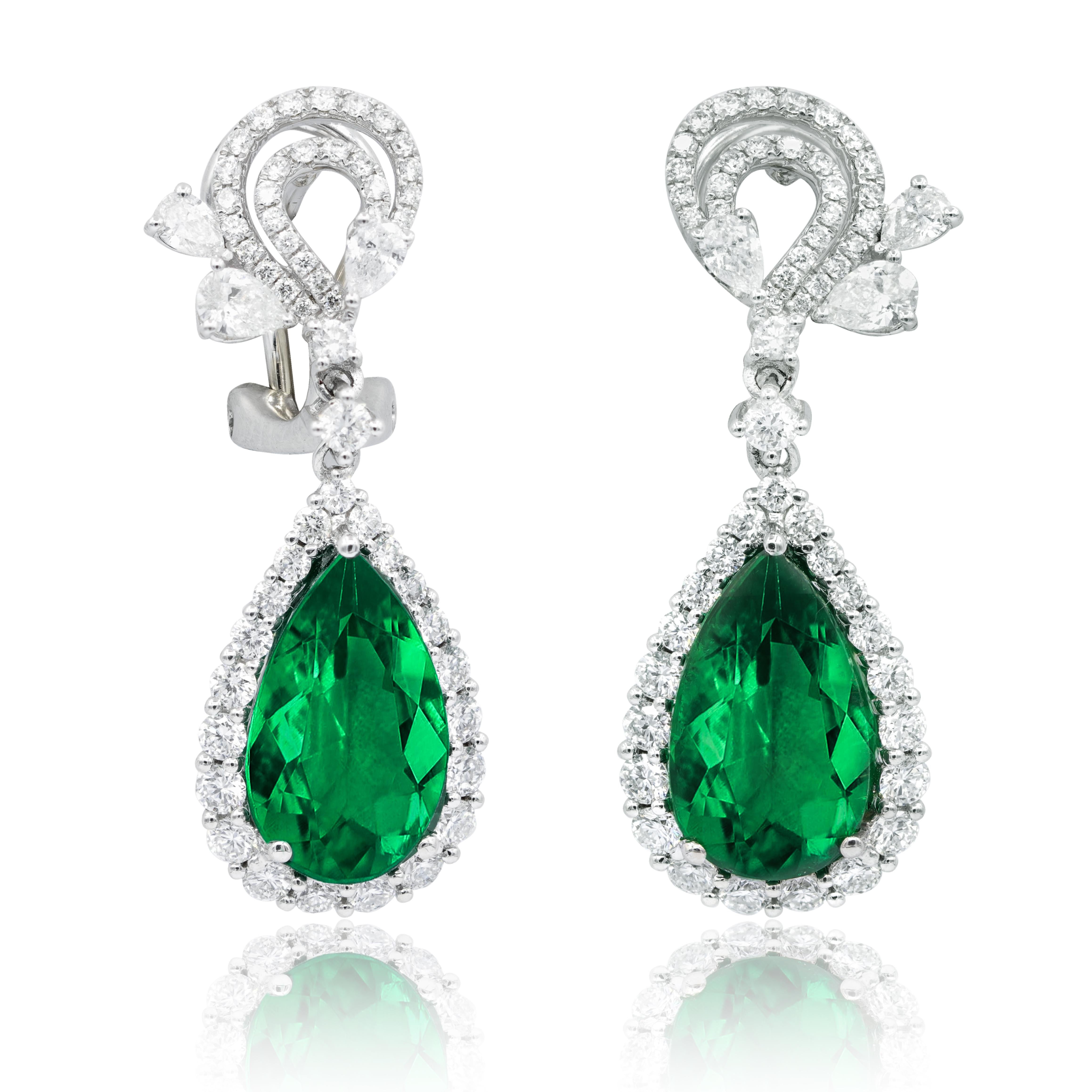 18KT white gold fashion drop earrings features 2.28 cts of white round and pear shaped diamonds and 8.73 cts of pear shaped emeralds.

This product will be packaged in a custom box

Composition:
18K white gold
2.28 ct round and pear shaped