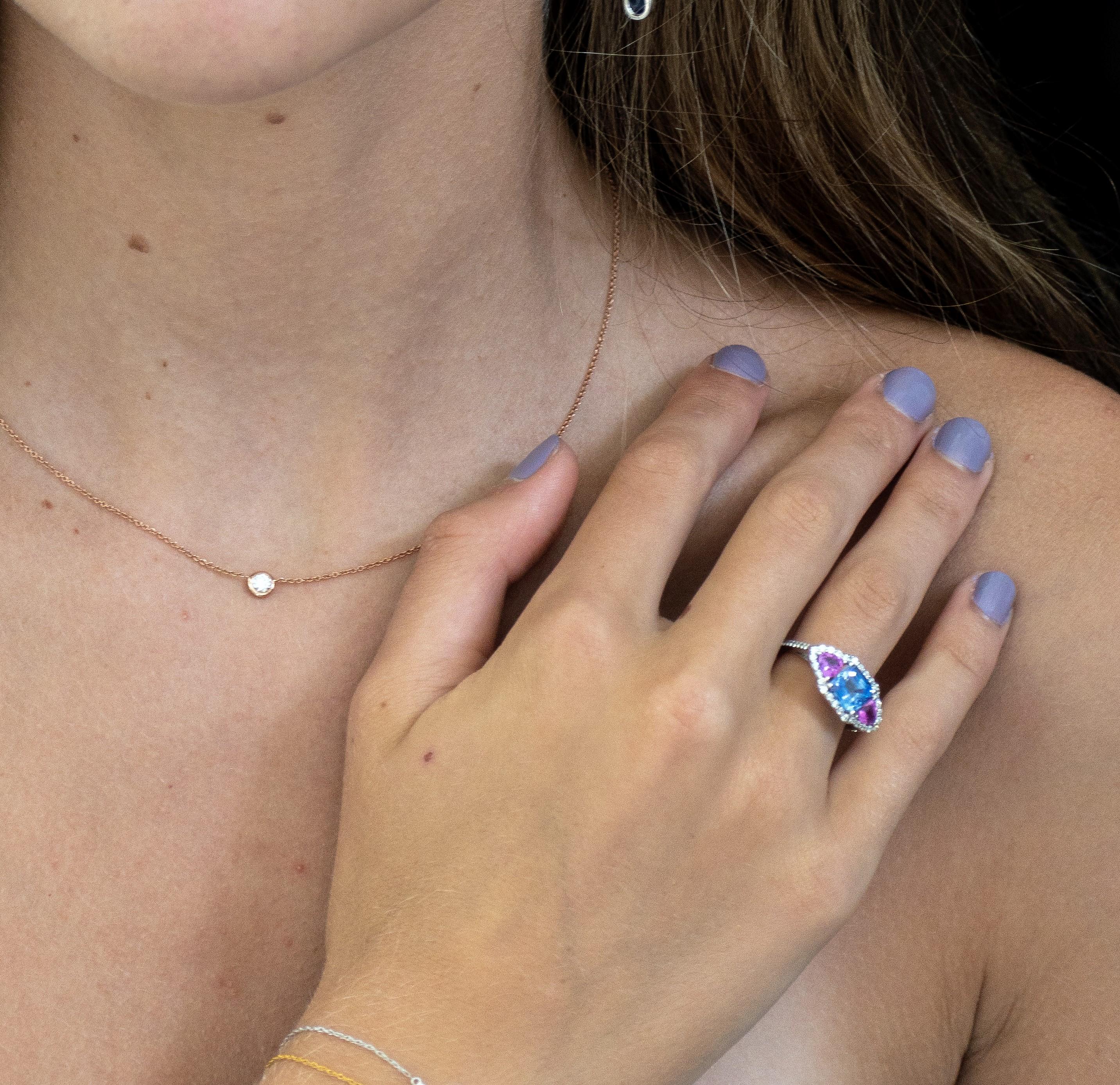 Featuring 14 karat white gold necklace pendant with one bezel-set round diamond  18