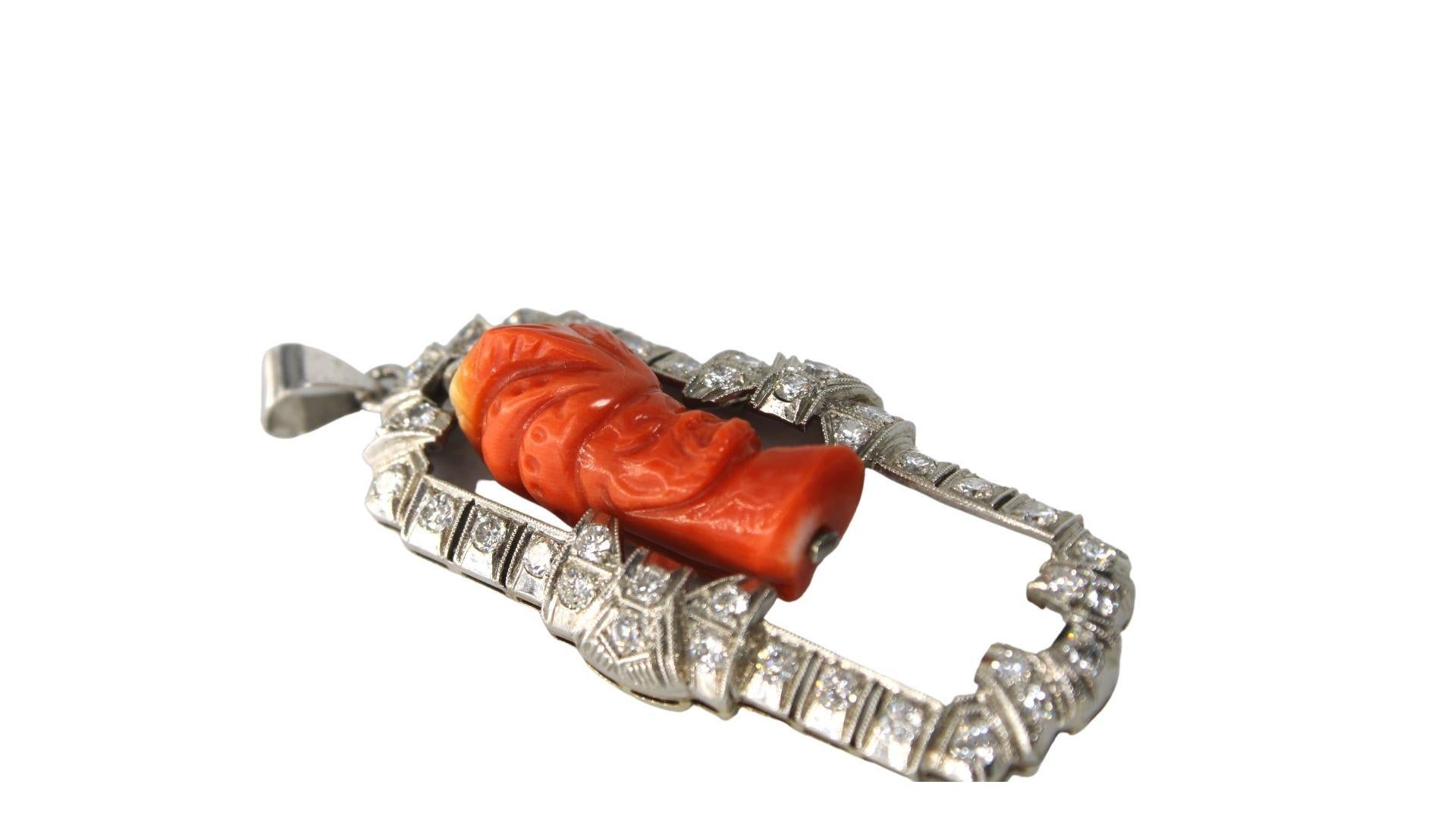 this Outstanding piece feturing a fabulous and very artistic Vintage coral pendant from the 1970's! This striking figural piece is set in vibrant 14kt white gold and 3.60ct of diamonds. This pedant is made of hand carved coral. The pendant is likely