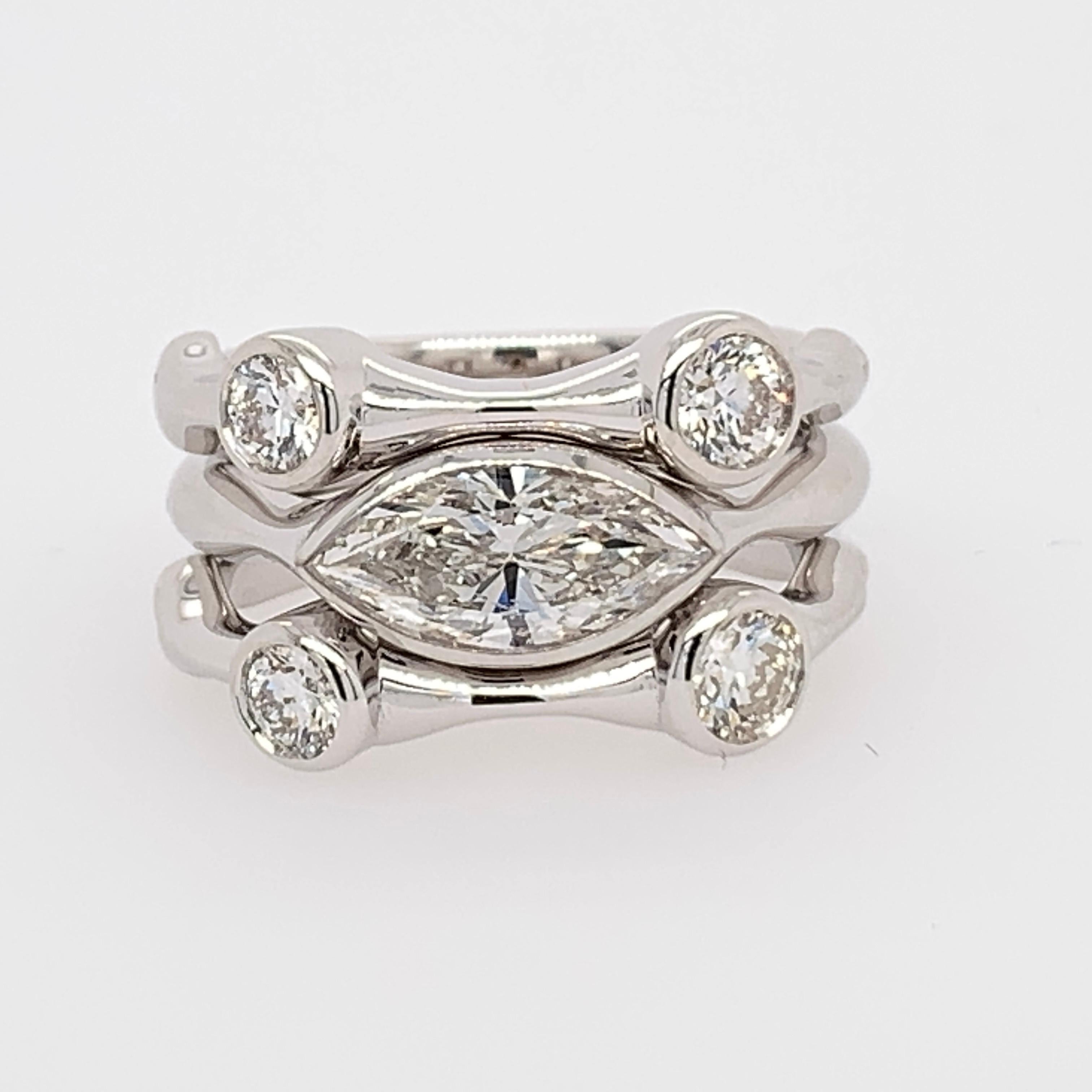 Stunning 18K White Gold Natural Diamond Cocktail Stack Ring Set. The rings are size 5.25 and weigh 10.52 grams.

The center ring is set with a 1.00 carat Natural Marquise Diamond certified by EGL as a G in color and SI1 in clarity (#LA210502031) and