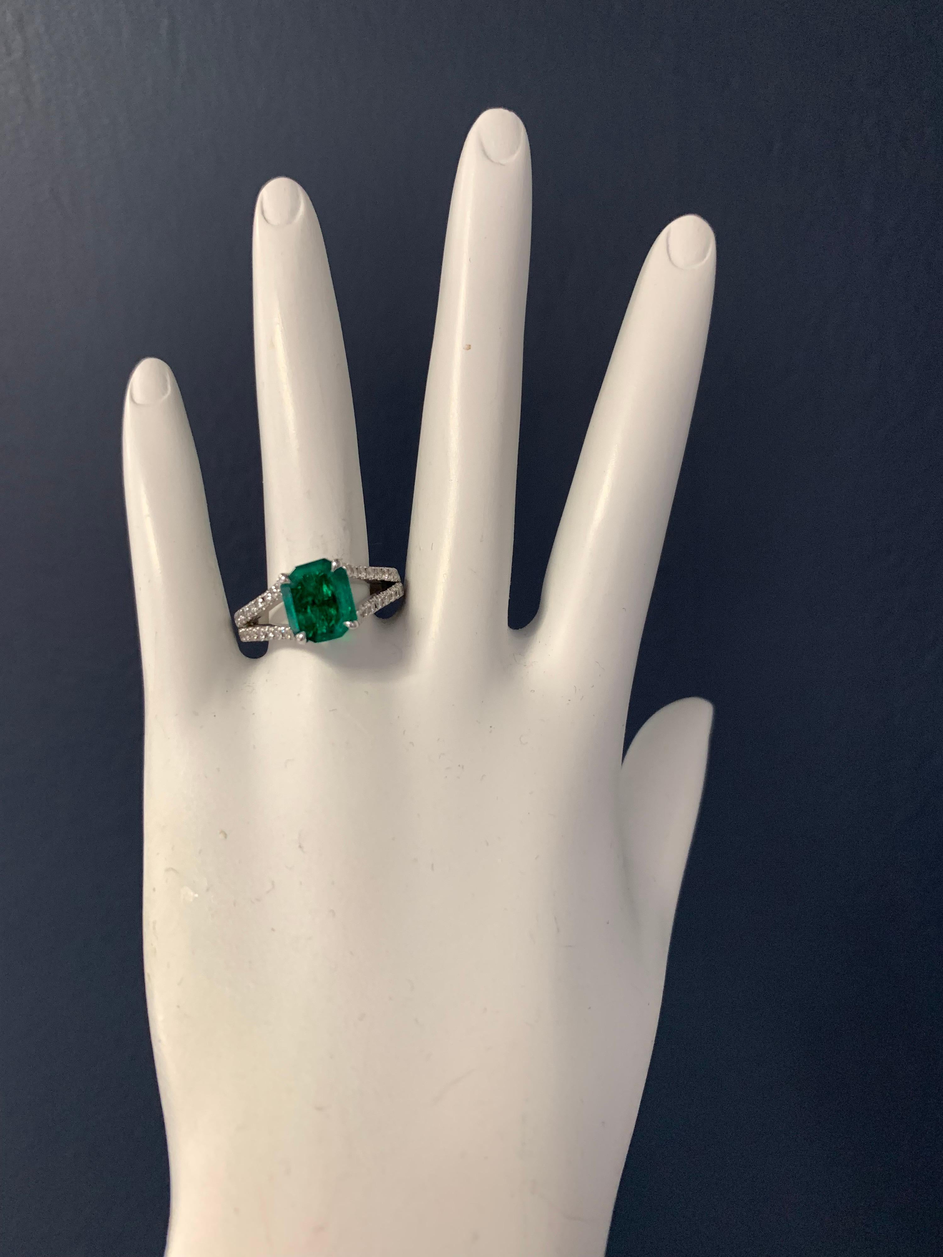 Stunning 18K White Gold Natural Emerald and Diamond Ring  (Size 7).

The centerstone is a 1.70 carat Natural Emerald measuring 9.22x7.68x3.11mm. The mounting consists of 40 Natural Round Brilliant Diamonds G in color and VS in clarity weighing 0.50