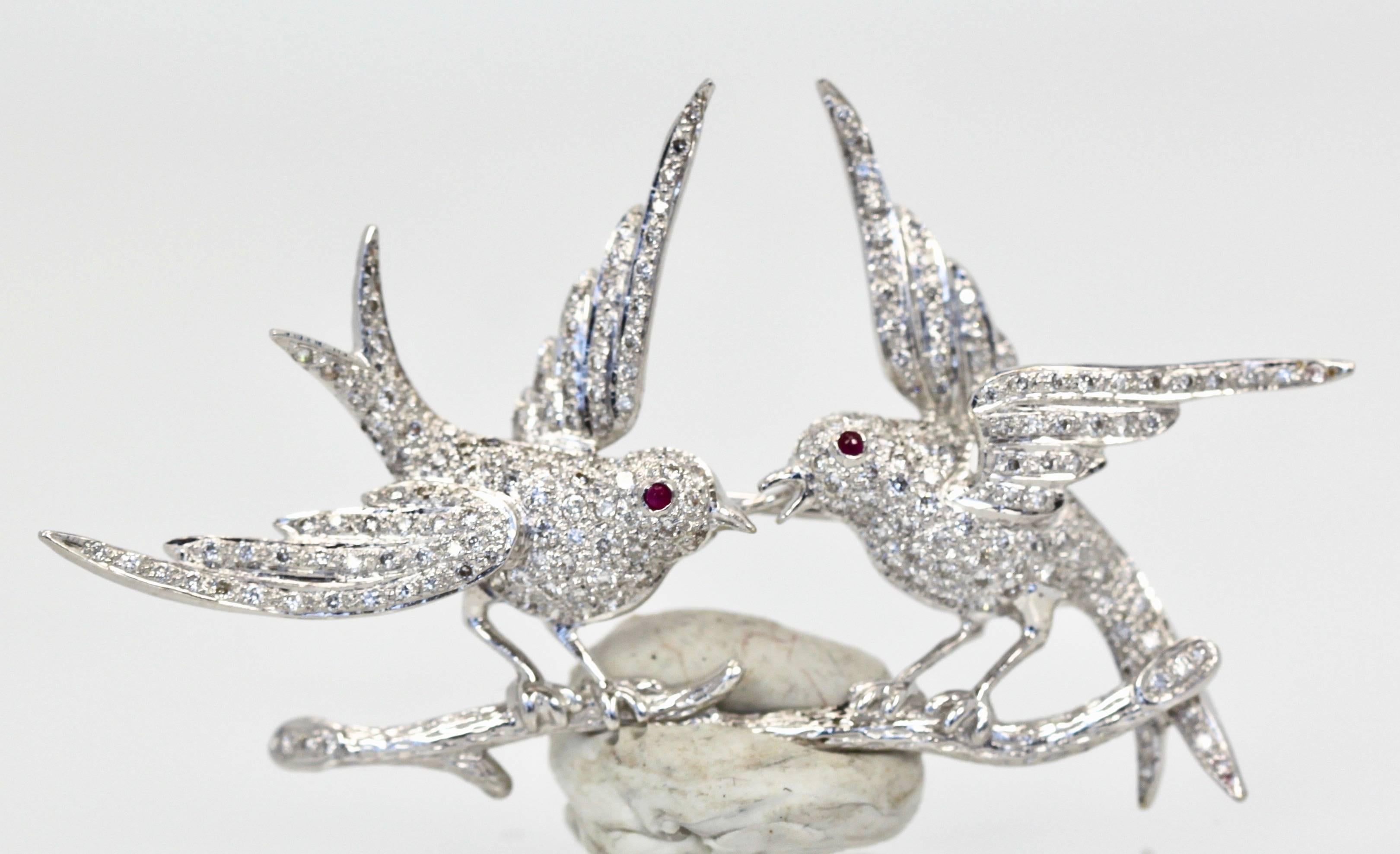 This Double Bird Brooch is covered in Diamonds and has Ruby eyes.  This brooch is large 2 3/4