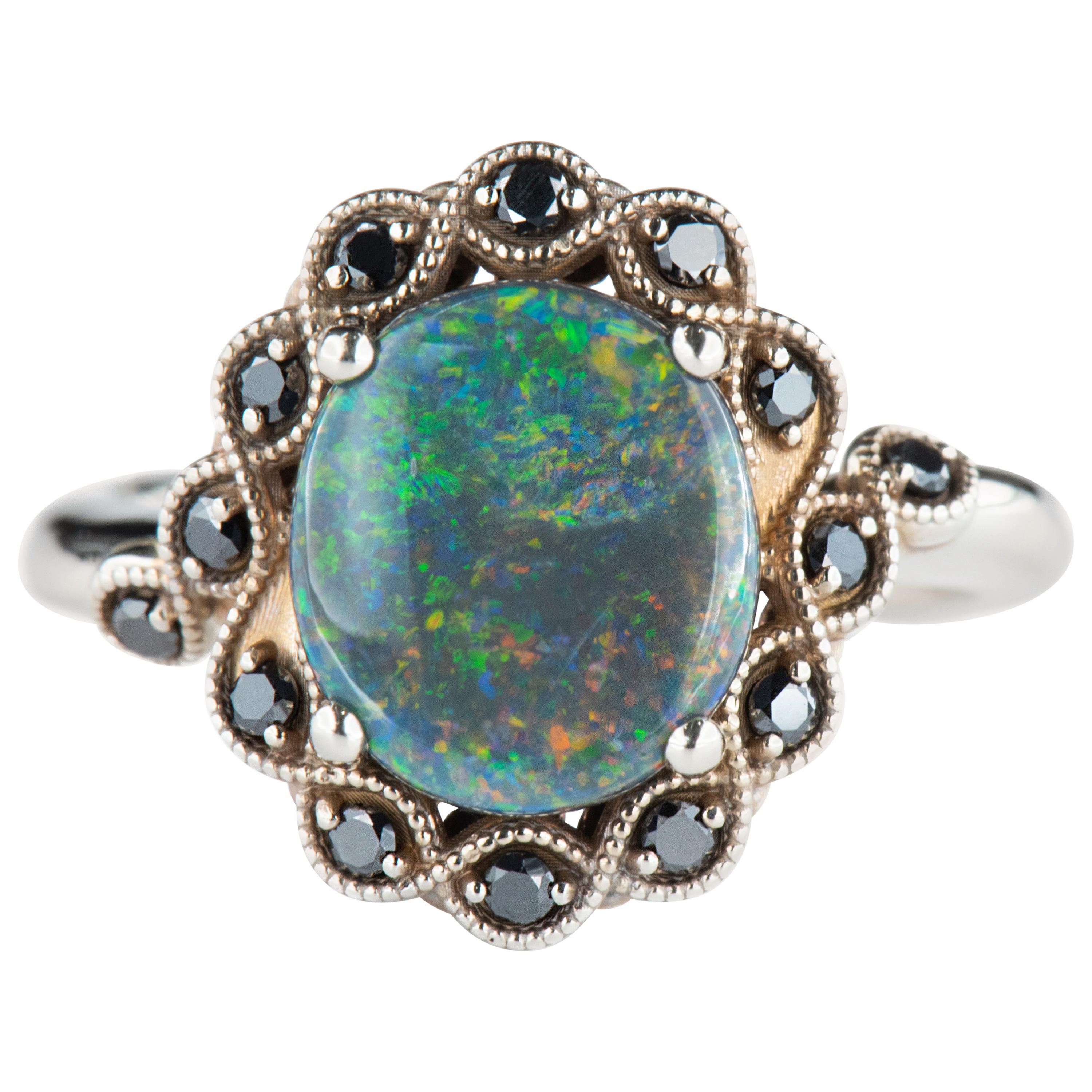 White Gold 2.30 Carat Oval Black Opal Halo Ring with Round Black Diamond Accents For Sale
