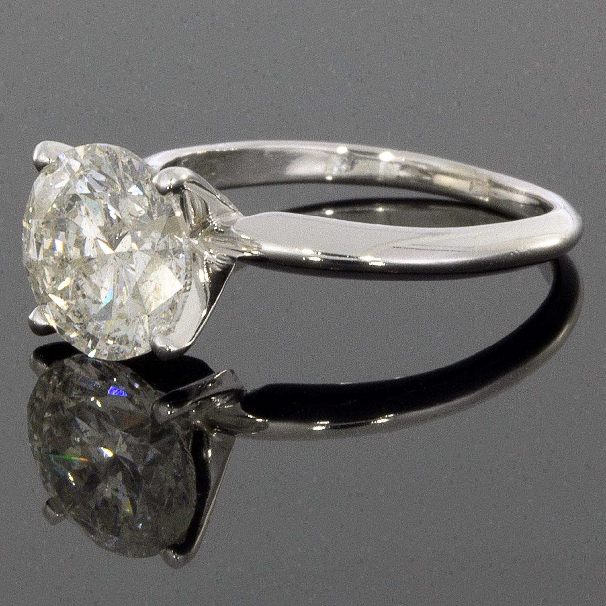 Item Details:
Main Stone: Diamond
Main Stone Shape: Round Brilliant
Main Stone Weight: 2.50 ct
Main Stone Color J
Main Stone Clarity: I2
Estimated Retail: $10,000.00
Metal: 14K White Gold
Style: Solitaire Engagement Ring
Ring Size: 5.5

Stone 1