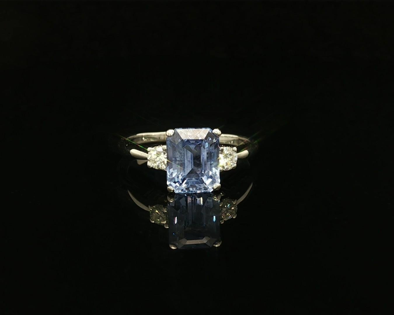 --Stone(s):--
(1) Natural Genuine Sapphire - Emerald Cut - Prong Set - Color Change - Bluish Violet Changing to Purple Color - No Heat - Ceylon - 3.22ct (exact)
** See Certification Details Below for Complete Info **
(2) Natural Genuine Diamonds -