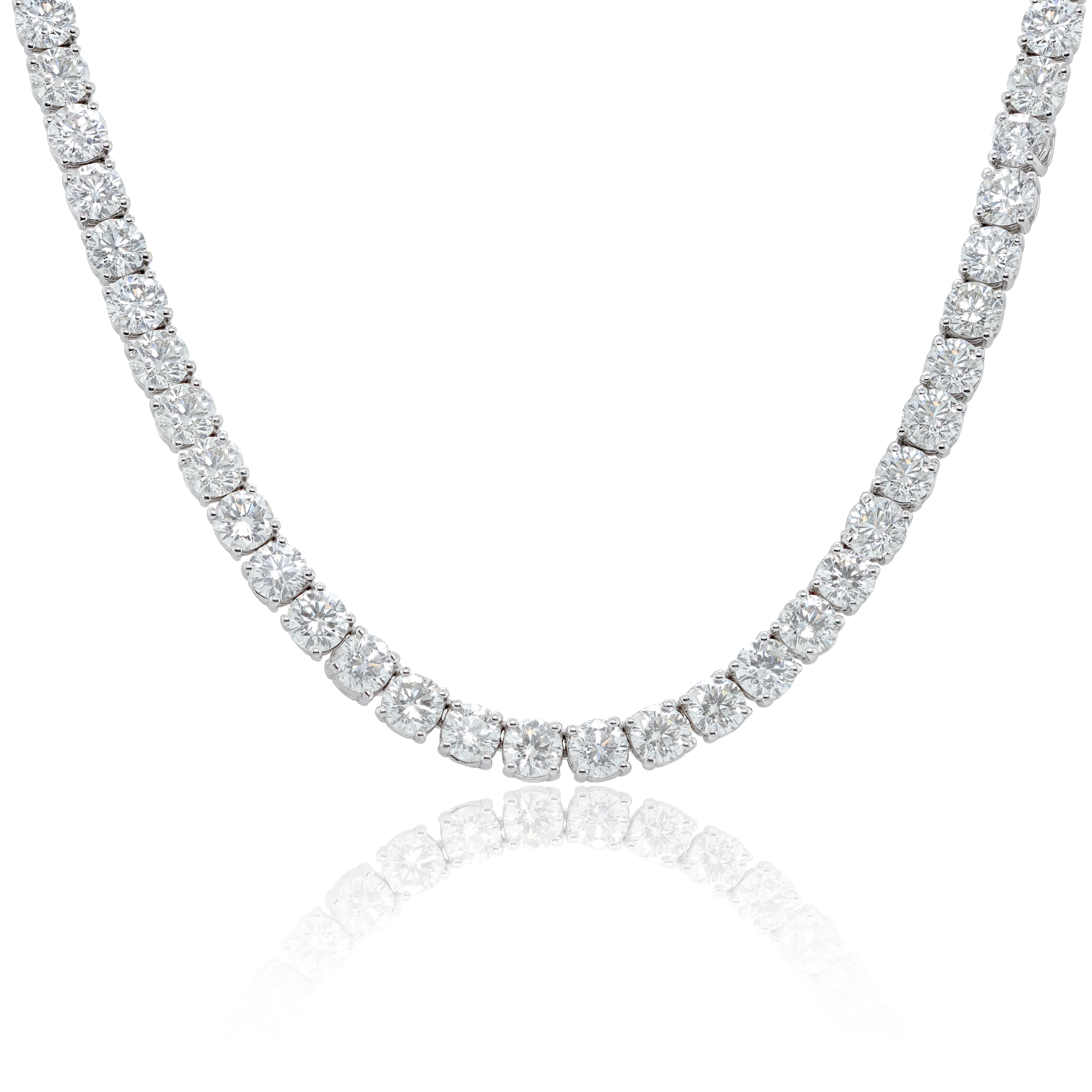 18KT white gold straight line tennis necklace features 40.80 cts of G-H color, SI clarity diamonds.

This product comes with a certificate of appraisal
This product will be packaged in a custom box

Composition:
18K white gold
40.80 cts white