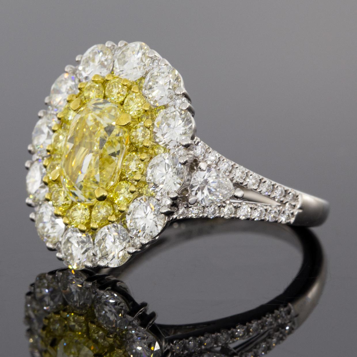 Oval Cut 4.64 Carat GIA Certified Fancy Light Yellow Oval Diamond Halo Engagement Ring