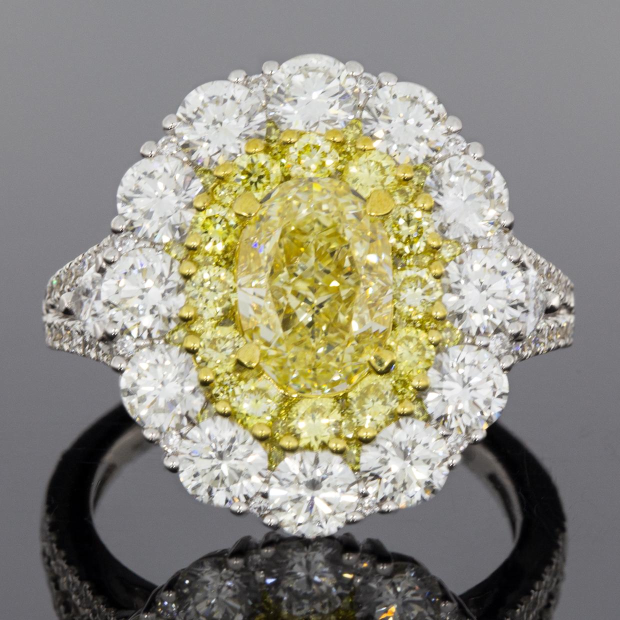Women's 4.64 Carat GIA Certified Fancy Light Yellow Oval Diamond Halo Engagement Ring