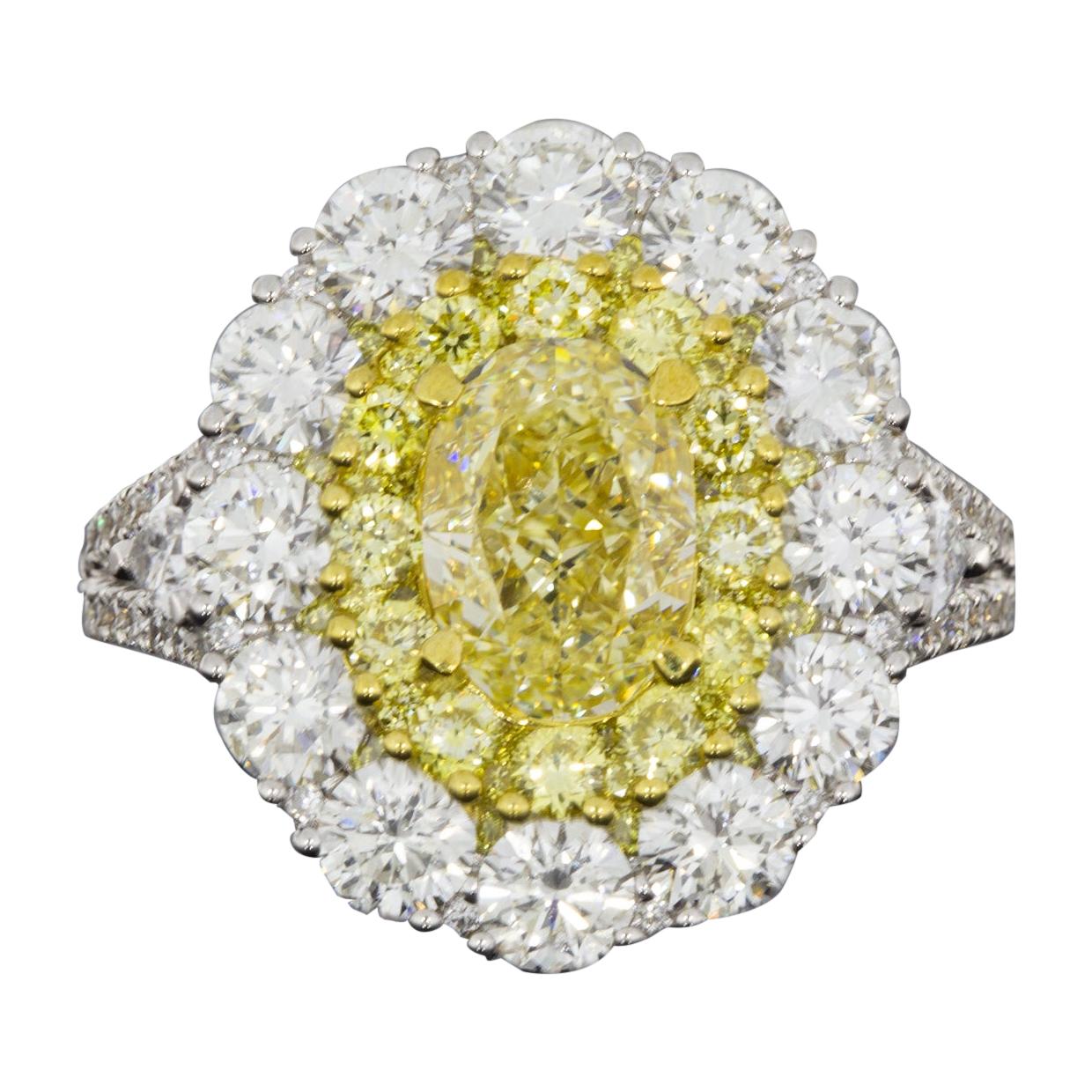 4.64 Carat GIA Certified Fancy Light Yellow Oval Diamond Halo Engagement Ring