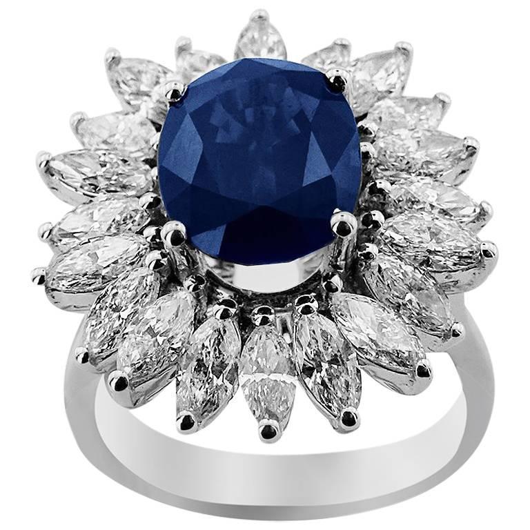Oval Cut White Gold 5.11 ct Sapphire with Marquise Cut Diamonds Ring For Sale