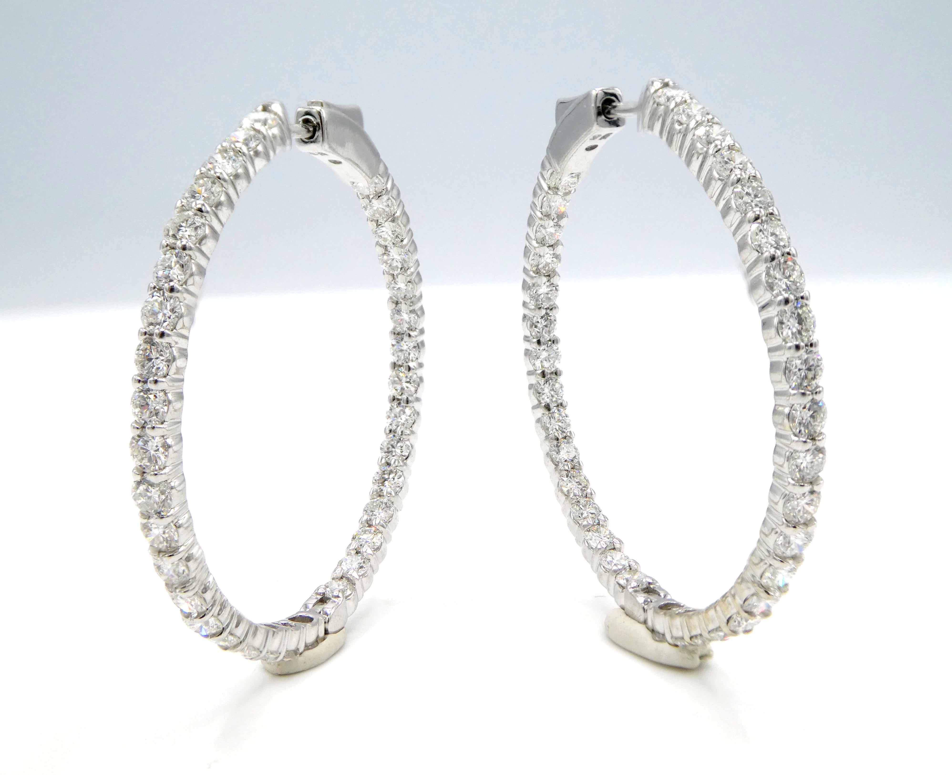 White Gold 5.50 Carat Inside Outside Hoop Earrings 
Metal: 14k white gold
Weight: 9.45 grams
Diamonds: 70 round natural diamonds approx. 5.5 CTW G-H VS
Diameter 36mm
Width: 2.7mm
