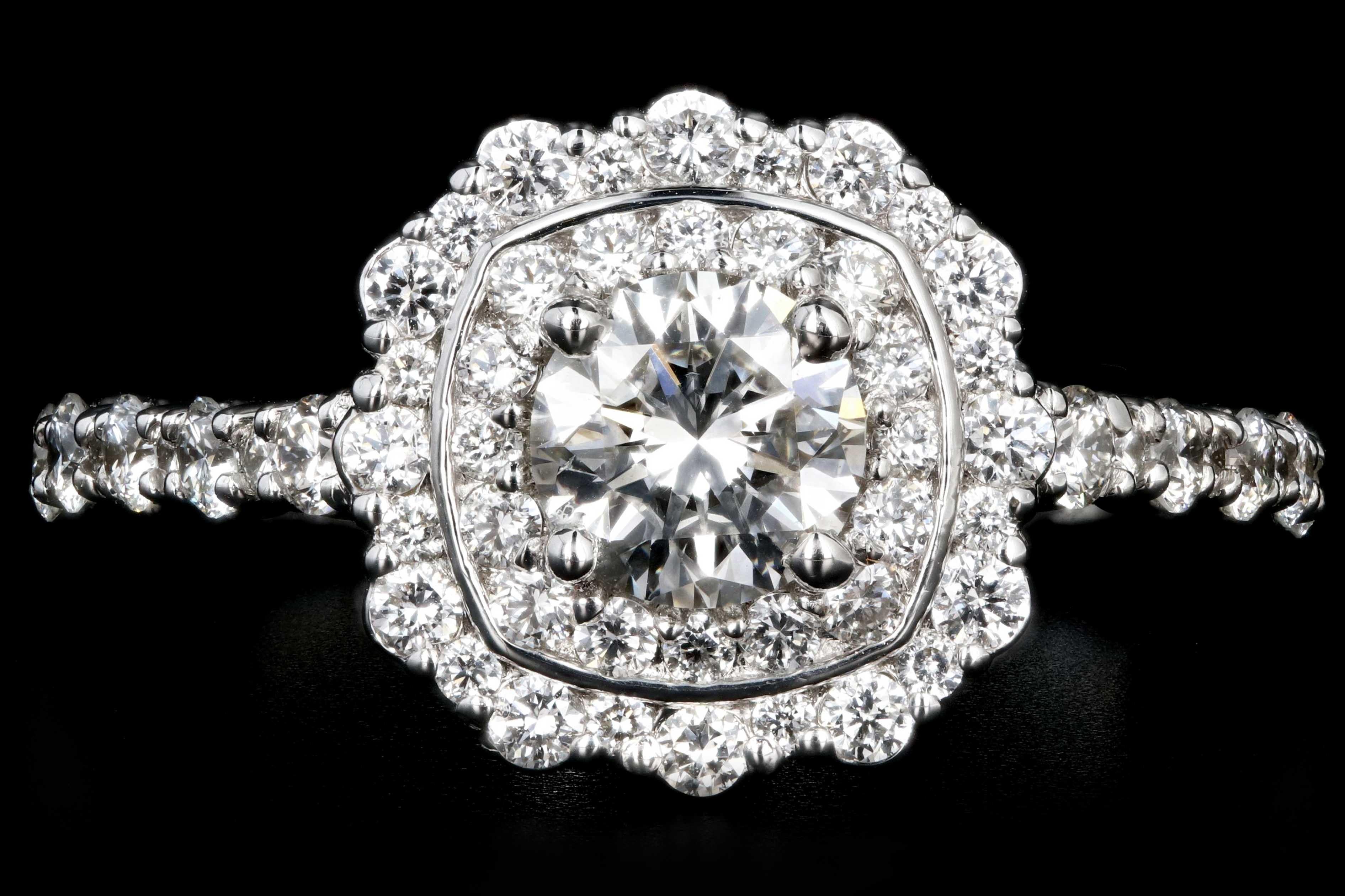 Era: New

Hallmarks: 18K

Composition: 18K White Gold

Primary Stone: Round Brilliant Cut diamond

Carat Weight: .59 Carats

Color/ Clarity: G / VS2

Accent Stone: Round Brilliant Cut Diamonds

Carat Weight: .71 Carats

Color/ Clarity: G-H/