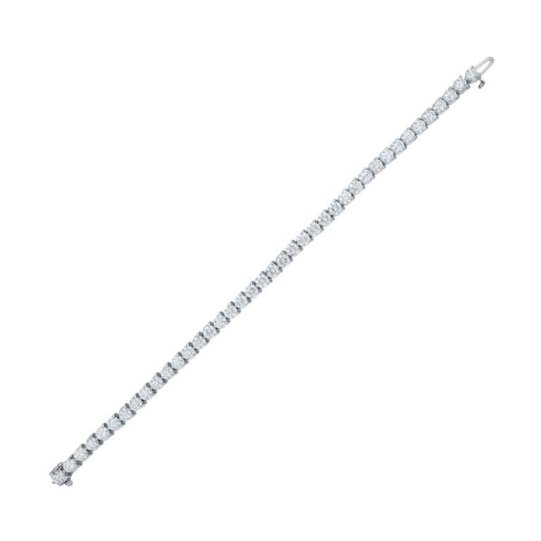 Stunning diamond tennis bracelet in three prong white gold diamond mounting! 

42 Round brilliant cut diamonds, totaling 6.09 Carats. Each stone approx, set in very delicate, timeless 14K White gold diamond mounting. 

Diamond specifications:
G-H