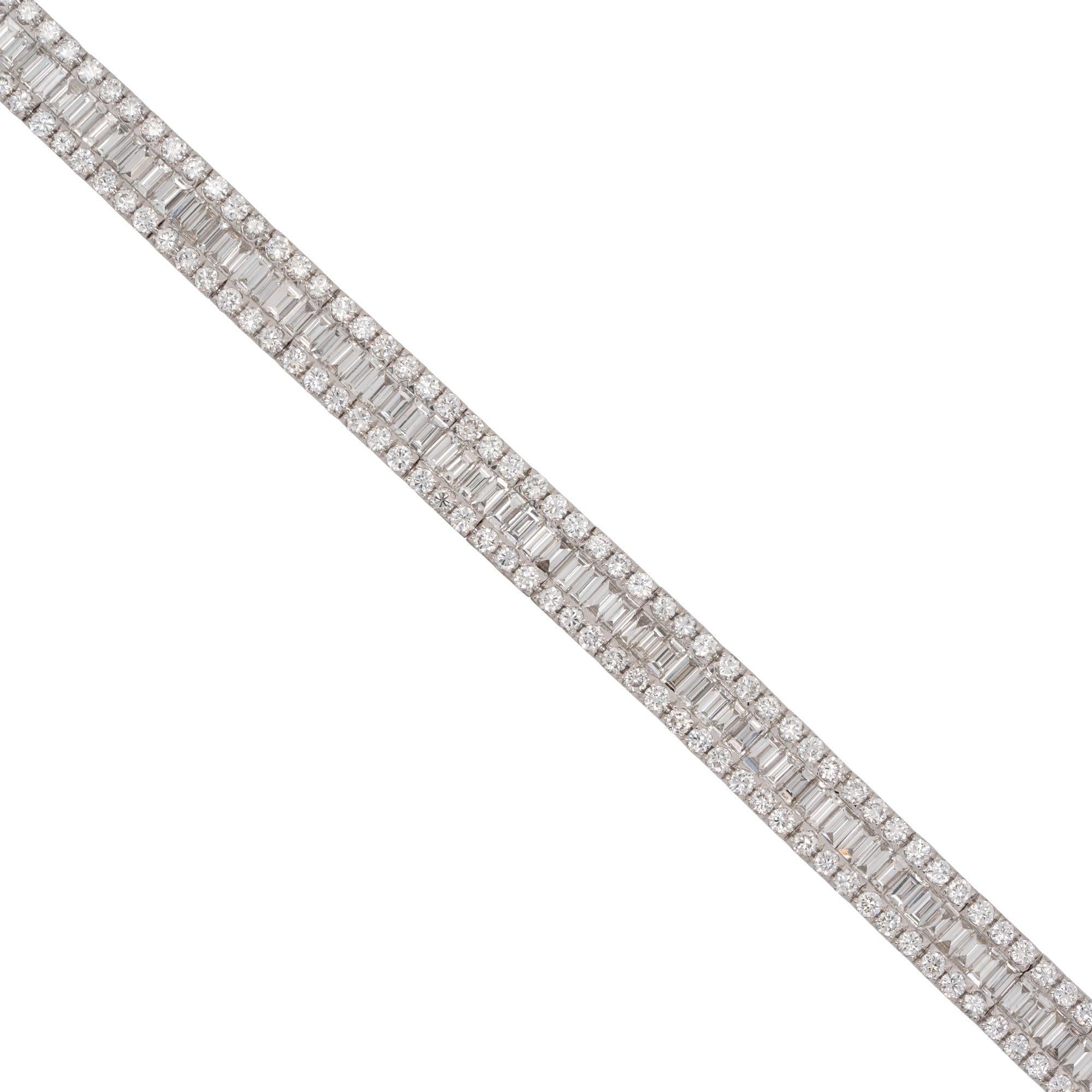 Material: 18k white gold
Diamond Details: Approx. 7.14ctw of round & baguette cut Diamonds . Diamonds are G/H in color and VS in clarity
Bracelet Measurements: 7 inches in length
Total Weight: 17.1g (11dwt)
Additional Details: This item comes with a