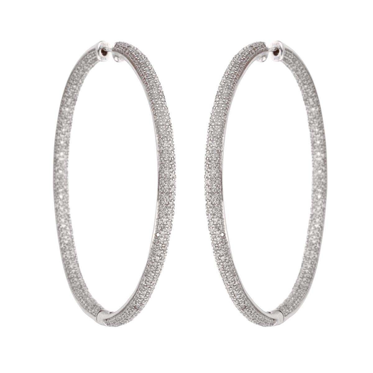 A fabulous set of chic diamond hoop earrings with appx 7ct of round brilliant cut diamonds set in 14k white gold. The earrings have a diameter of 2.5