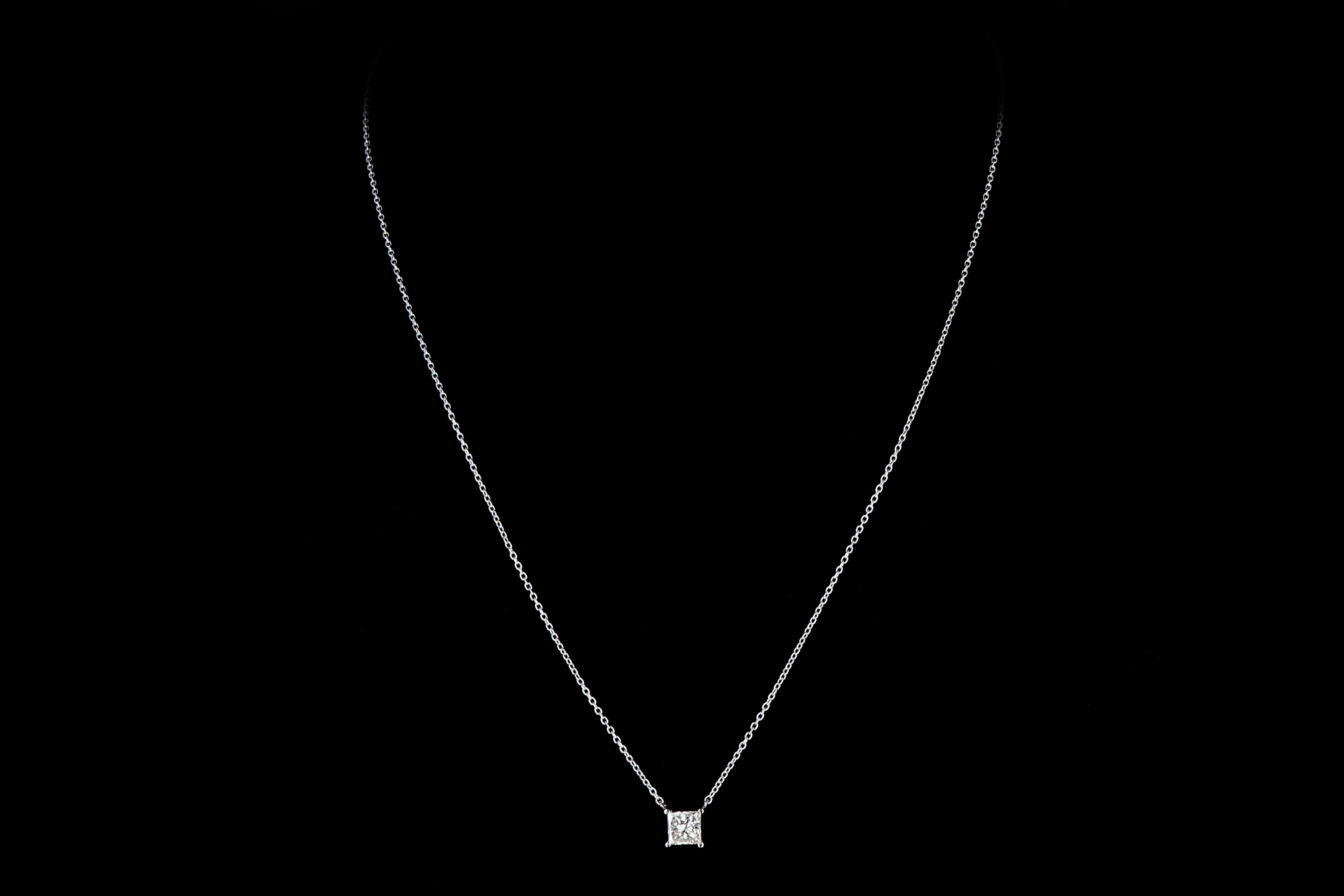 Era: New

Composition: 14K White Gold

Primary Stone: Princess Cut Diamond

Carat Weight: .98 Carat

Color: H

Clarity: I1 

Necklace Weight: 1.65 DWT 

Necklace Length: 18'' can be adjusted to 16''