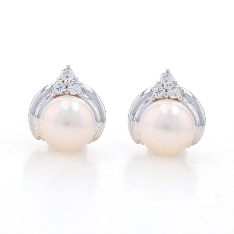 Metal Content: 14k White Gold

Stone Information
Akoya Pearls
Color: White
Diameters: 8mm & 8.1mm

Natural Diamonds
Carat(s): .18ctw
Cut: Round Brilliant
Color: F - G
Clarity: VS1 - VS2

Total Carats: .18ctw

Style: Stud
Fastening Type: Butterfly