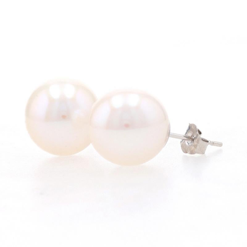 Metal Content: 14k White Gold  

Stone Information: 
Natural Akoya Pearls
Color: White   
Diameter Range: 10.5mm - 11mm

Style: Stud
Fastening Type: Butterfly Closures 

Measurements: 
Diameter: 7/16