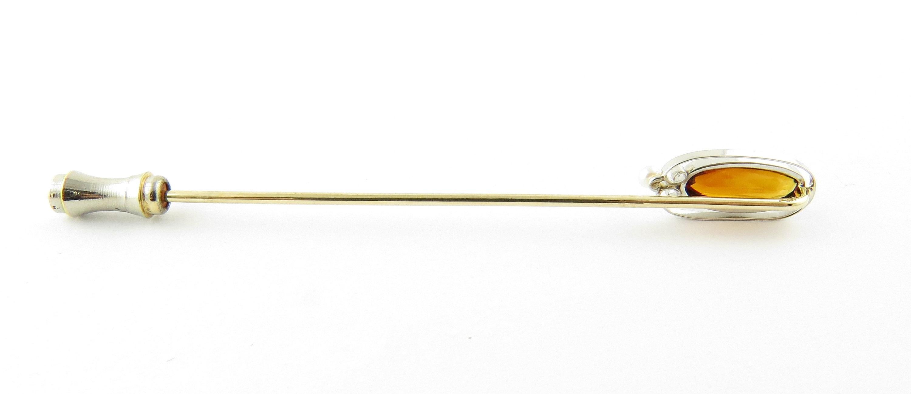 Vintage 14 Karat White Gold Amber and Seed Pearl Stick Pin- This elegant stick pin features one oval amber gemstone (12 mm x 6 mm) accented with one seed pearl and set in beautifully detailed 14K white gold. Size: 3 inches Weight: 1.9 dwt. / 3.1 gr.