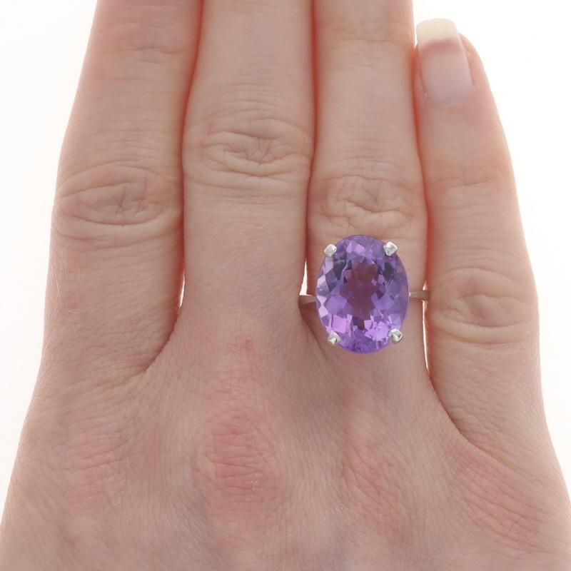 Size: 6 3/4
Sizing Fee: Up 2 sizes for $40 or Down 2 sizes for $35

Metal Content: 18k White Gold

Stone Information
Natural Amethyst
Carat(s): 8.87ct
Cut: Oval
Color: Purple

Total Carats: 8.87ct

Style: Cocktail Solitaire

Measurements
Face Height