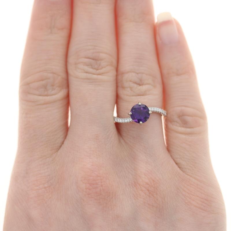 Size: 6 1/2
Sizing Fee: Up 2 sizes for $35

Metal Content: 14k White Gold

Stone Information
Natural Amethyst
Carat(s): 1.12ct
Cut: Round
Color: Purple

Natural Diamonds
Carat(s): .15ctw
Cut: Round Brilliant 
Color: F - G
Clarity: SI1 - SI2

Total