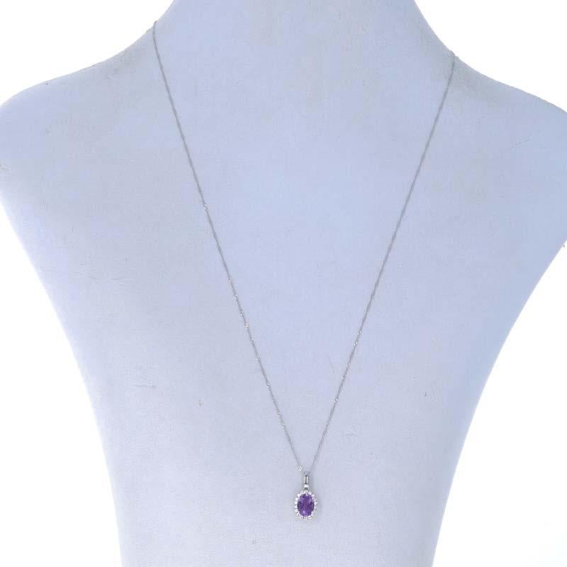 Metal Content: 14k White Gold

Stone Information

Natural Amethyst
Carat(s): .89ct
Cut: Oval
Color: Purple

Natural Diamonds
Carat(s): .11ctw
Cut: Round Brilliant
Color: G
Clarity: SI1

Total Carats: 1.00ctw

Style: Halo
Chain Style: Fancy
Necklace