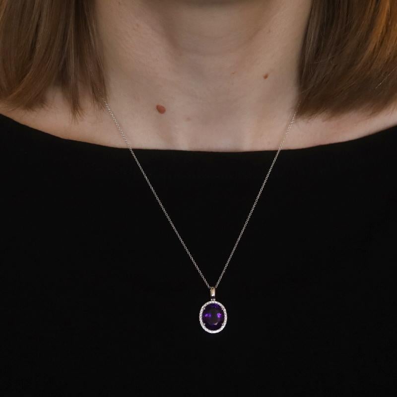 Metal Content: 14k White Gold

Stone Information

Natural Amethyst
Carat(s): 4.81ct
Cut: Oval
Color: Purple

Natural Diamonds
Carat(s): .18ctw
Cut: Round Brilliant
Color: G
Clarity: SI1

Total Carats: 4.99ctw

Style: Halo
Chain Style: Cable
Necklace