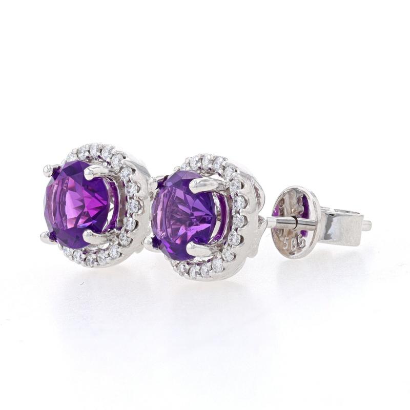 Metal Content: 14k White Gold

Stone Information

Natural Amethysts
Carat(s): 1.42ctw
Cut: Round
Color: Purple

Natural Diamonds
Carat(s): .20ctw
Cut: Round Brilliant
Color: G
Clarity: SI1

Total Carats: 1.62ctw

Style: Halo Stud
Fastening Type: