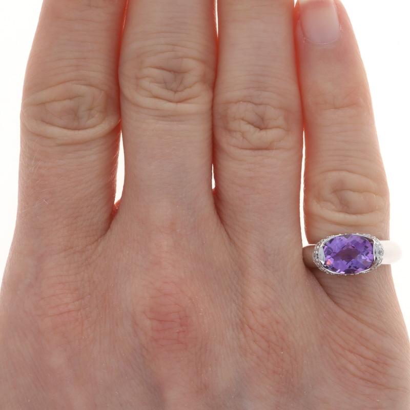 Size: 3 1/2

Metal Content: 14k White Gold

Stone Information

Natural Amethyst
Carat(s): 1.80ct
Cut: Oval Checkerboard
Color: Purple

Natural Diamonds
Carat(s): .15ctw
Cut: Round Brilliant
Color: G - H
Clarity: SI1 - SI2

Total Carats: