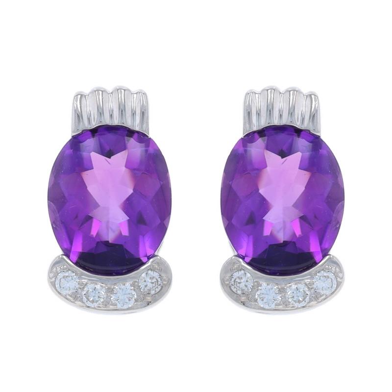 Metal Content: 14k White Gold

Stone Information

Natural Amethysts
Carat(s): 3.50ctw
Cut: Buff Top Oval
Color: Purple

Natural Diamonds
Carat(s): .12ctw
Cut: Round Brilliant
Color: G - H
Clarity: VS1 - VS2

Total Carats: 3.50ctw

Style:
