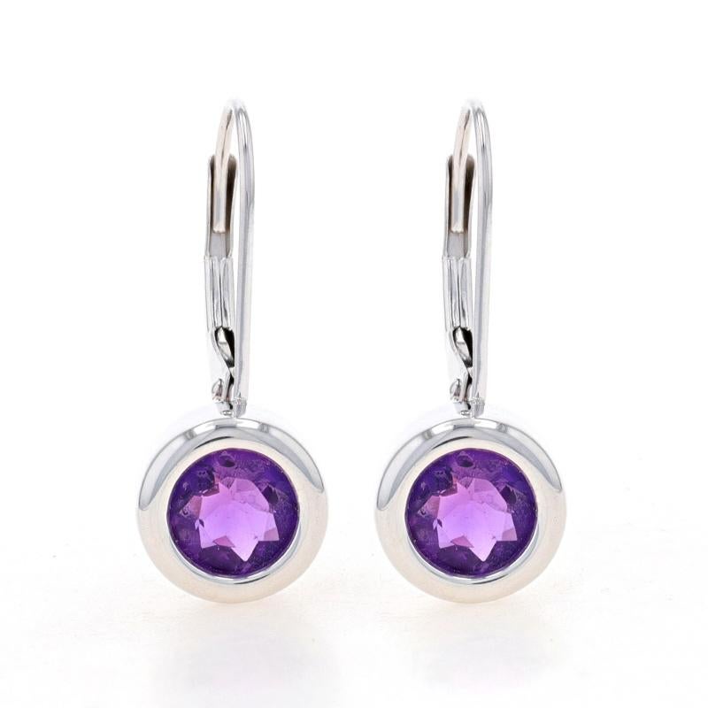 Metal Content: 14k White Gold

Stone Information
Natural Amethysts
Carat(s): 1.35ctw
Cut: Round
Color: Purple

Total Carats: 1.35ctw

Style: Drop
Fastening Type: Leverback Closures
Features: Bezel Set Stones

Measurements
Tall: 27/32