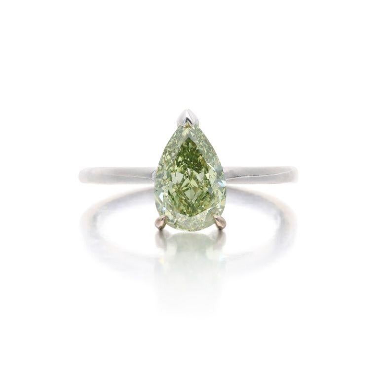 Centering a pear-shaped Fancy Deep Grayish Yellowish Green diamond.
Diamond weighs 1.76 carats
18 karat white gold
Total weight 3.85 grams
Size 6¼
Accompanied by GIA report no. 3345414280, dated 24 February 2021, stating that the 1.76 carat diamond