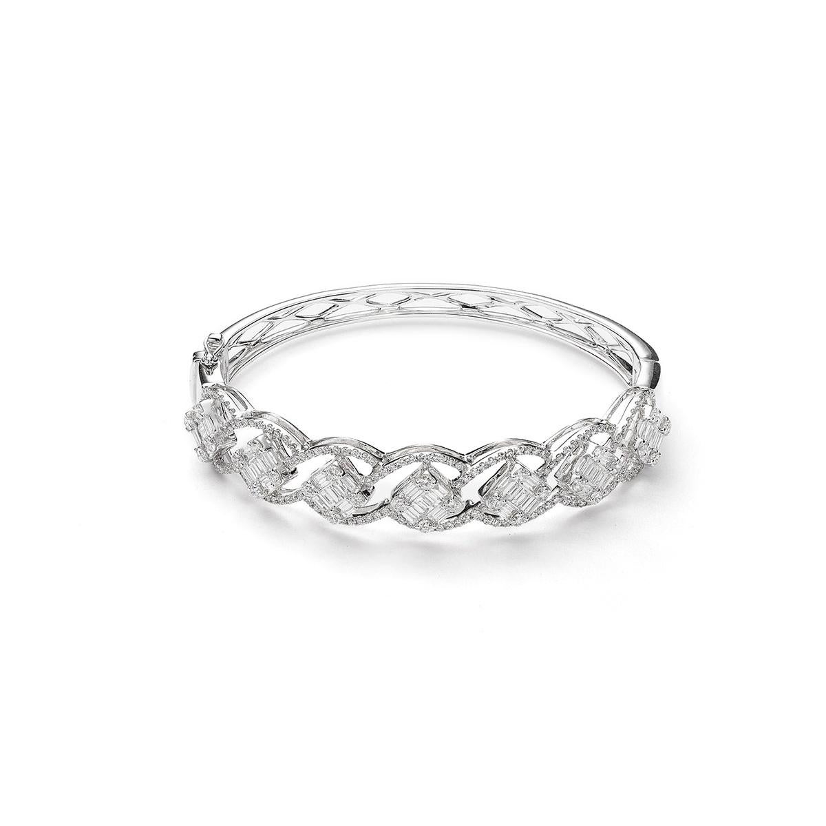 Bangle in 18kt white gold set with 174 diamonds 1.97 cts and 63 baguette cut diamonds 1.65 cts        