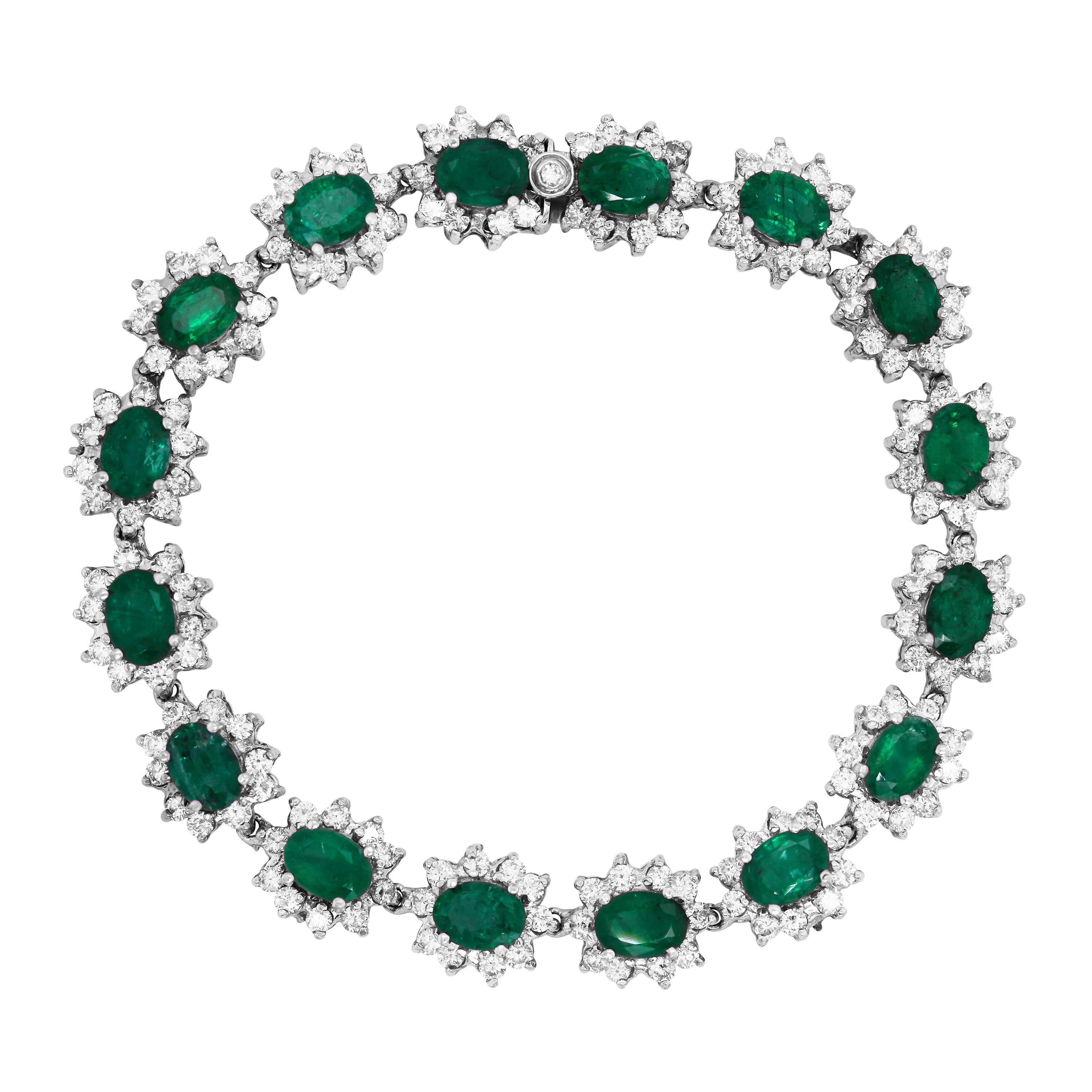 14k White Gold and Diamond Bracelet with Oval Cut Zambian Emeralds

This bracelet features 16 oval Zambian Emeralds surrounded with diamonds in each section

Apprx. 12.50 carat Emeralds. The Emeralds origin are from Zambia

Apprx. 5 carat G color,