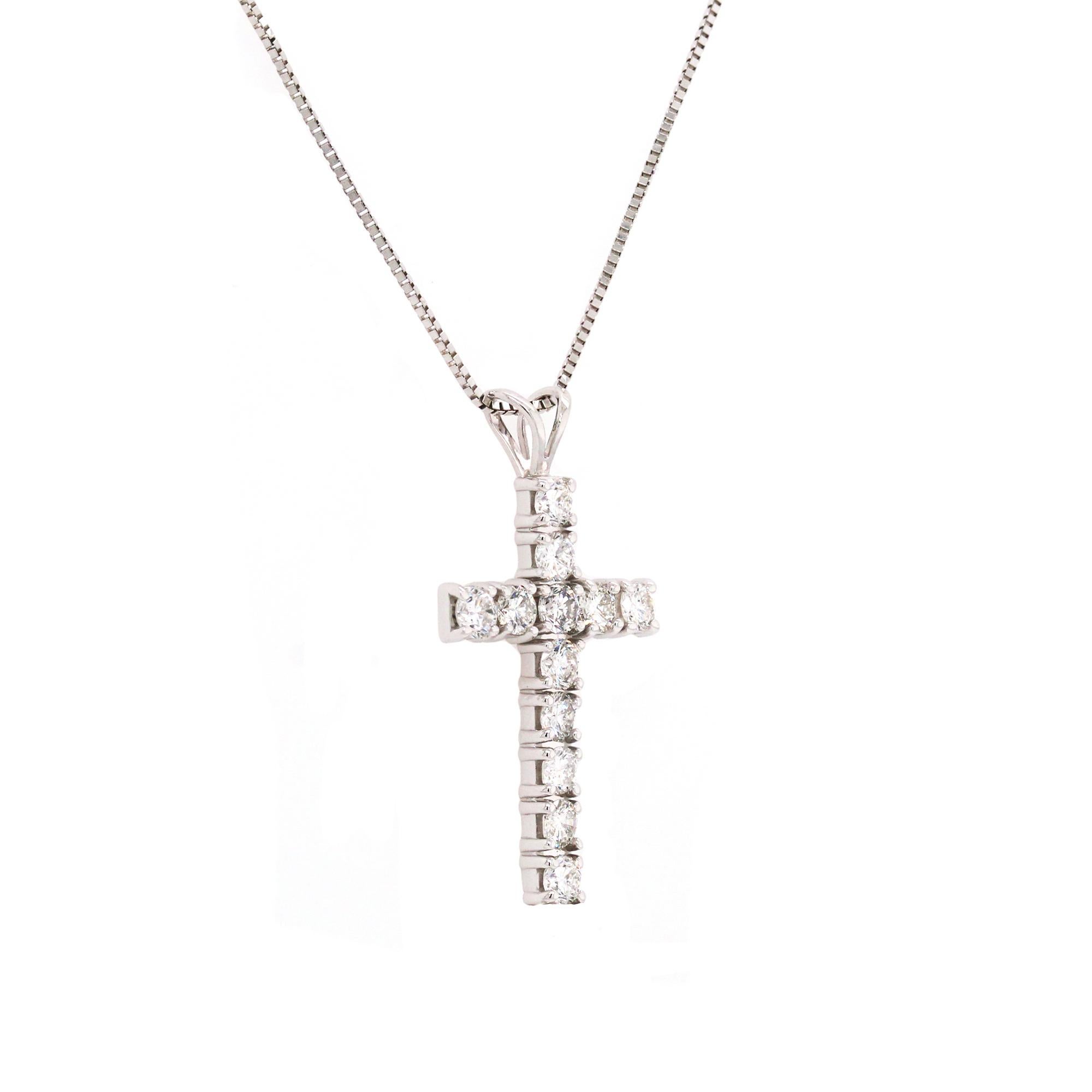 14K White Gold and Diamond Cross Pendant Necklace with Chain

Cross has 1 carat in diamonds total weight. G color, VS clarity diamonds. 12 diamonds total

Cross is 1 inch by 0.60 inch.

Chain is 16 inches in length.