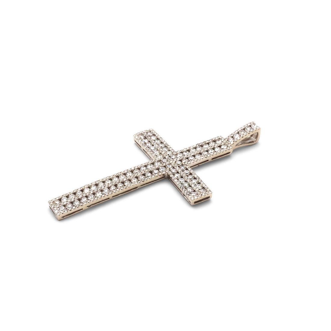 A cross pendant crafted in 18 karat white gold. The pendant is set with dazzling round brilliant cut diamonds of an estimated 3.00 total carat weight. The pendant measures 2.4 inches in length and at its widest point, 1.20 inches in width. The