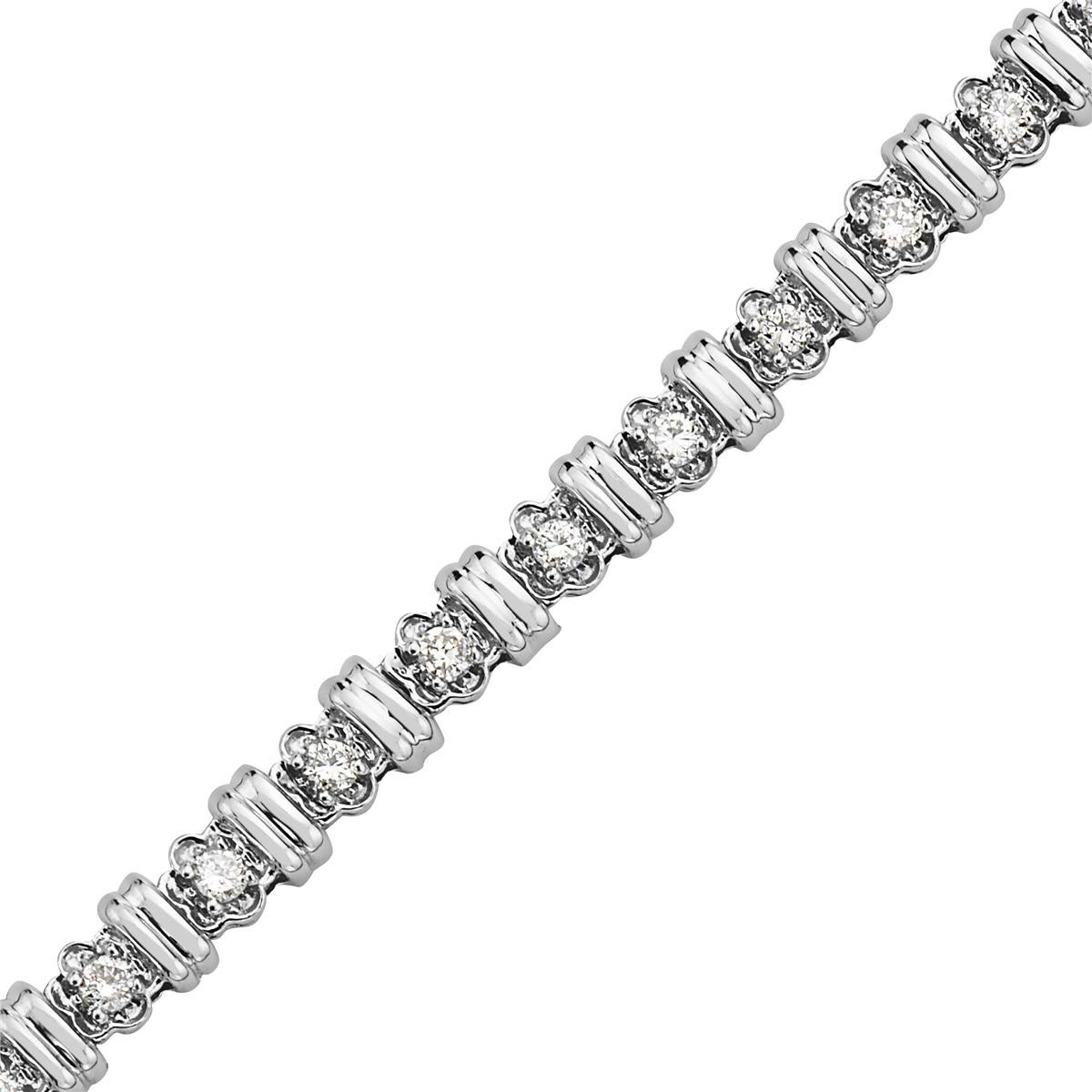 This bracelet features 0.75 carats of round diamonds set in 14K white gold. 7.5 inch. 10.7 grams total weight. 


Viewings available in our NYC showroom by appointment.