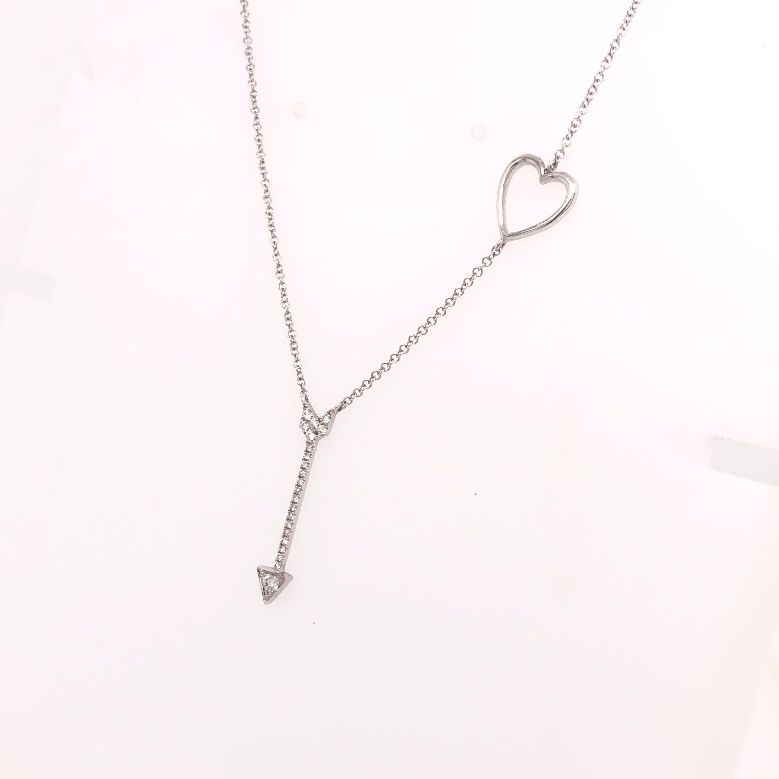 Subtly flirty, this heart and arrow necklace is a wonderful gift for something she will wear every day. 

14K White Gold, 0.13 CTW Round Diamonds (22 diamonds).
Adjustable length with jump rings at 19