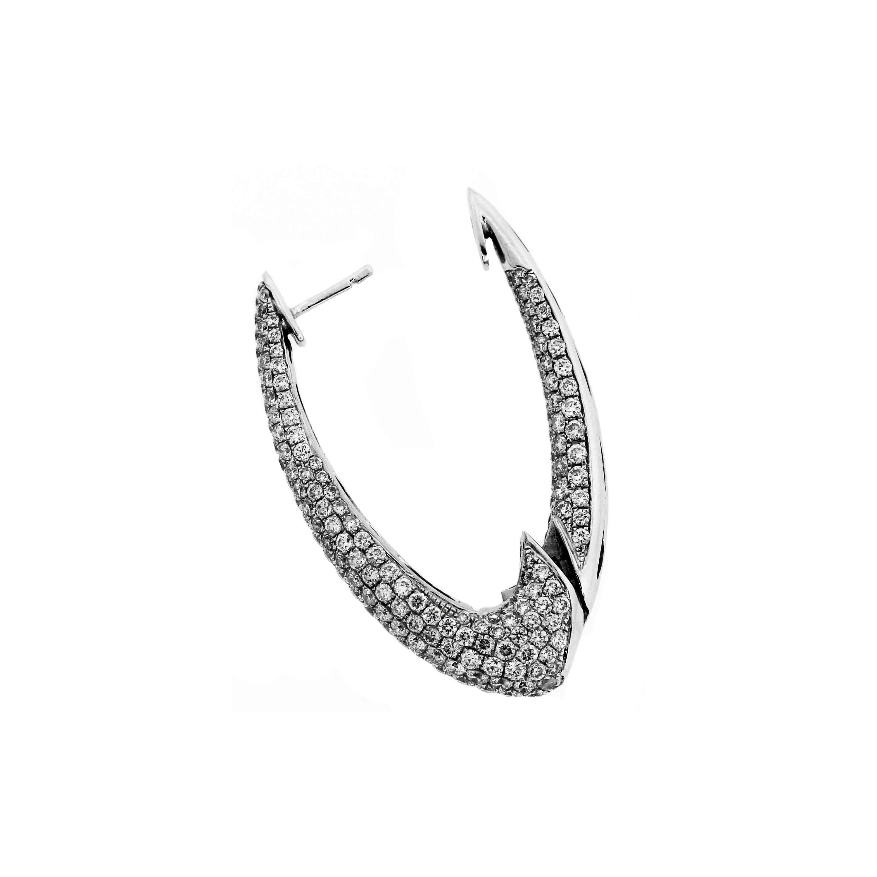 18K White Gold and Diamond Inside-Out Oval Shape Hoop Earrings

Apprx. 8 carat G Color, VS Clarity Diamonds cover these entire pair of earrings.

Earrings are 1.6 inches in length and have diamonds set on the edges as well.