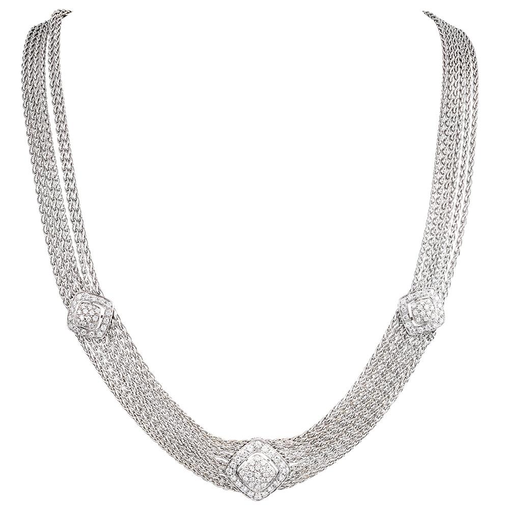 Sensuous and comfortable, the pieces drape effortlessly over your neck and wrist, displaying beautiful movement and a luxurious look that can be worn with both formal and informal attire. The necklace is accented with three diamond-studded stations,