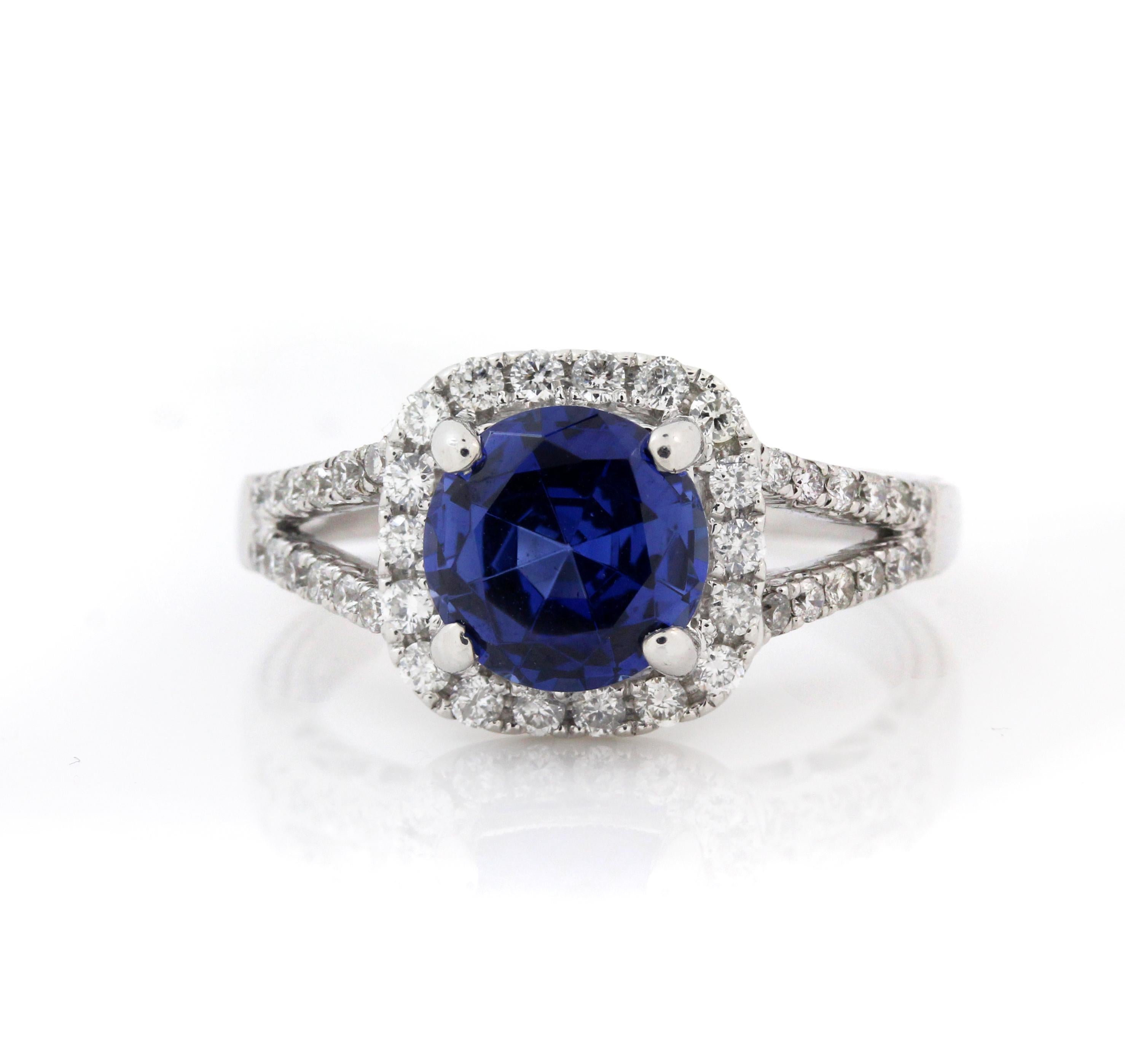 14K White Gold and Diamond Ring with Tanzanite Center

Tanzanite is gorgeous in color. 8mm round apprx. 3.20 carat

0.80 carat diamonds

Size 6. Sizable. 